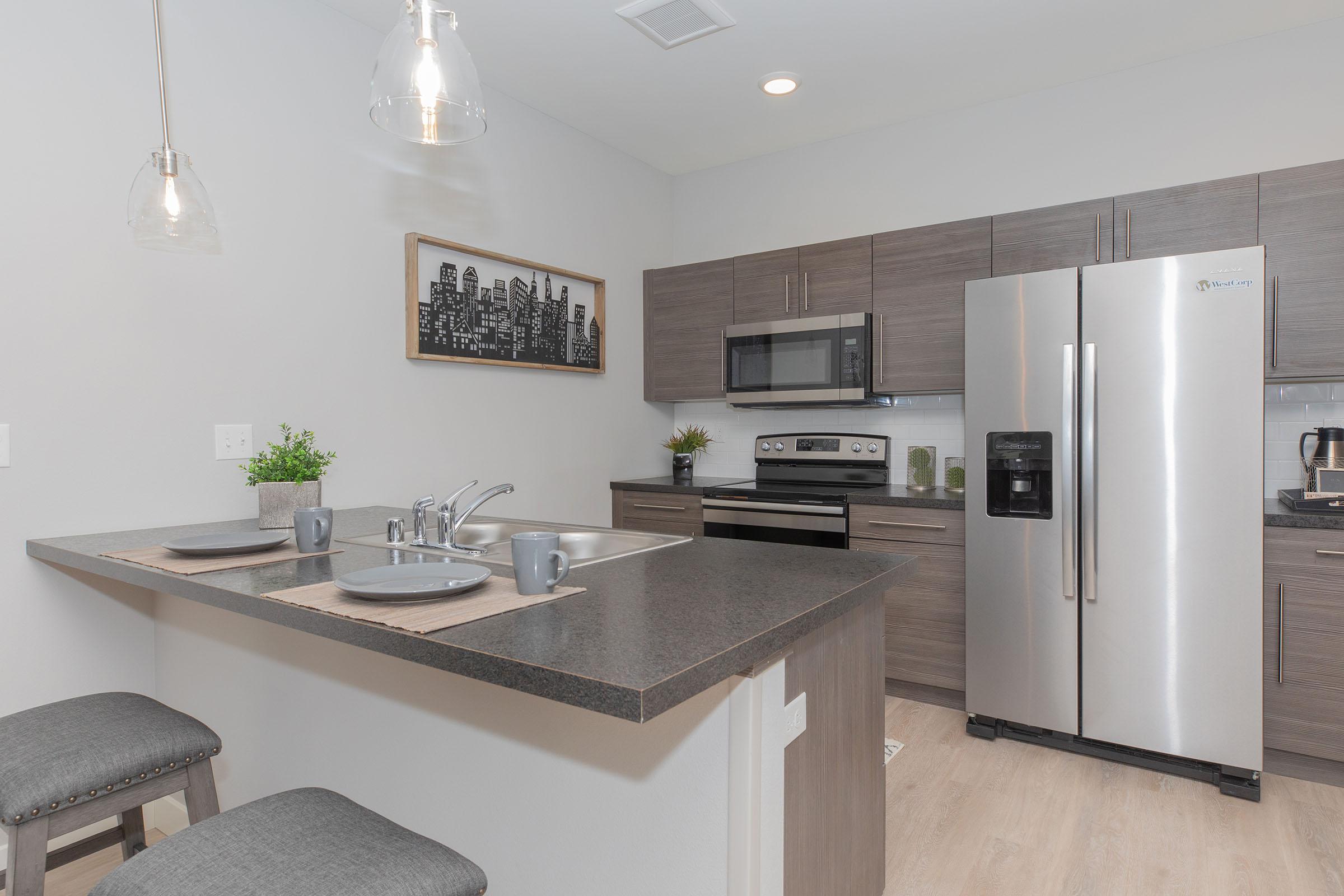 a modern kitchen with stainless steel appliances