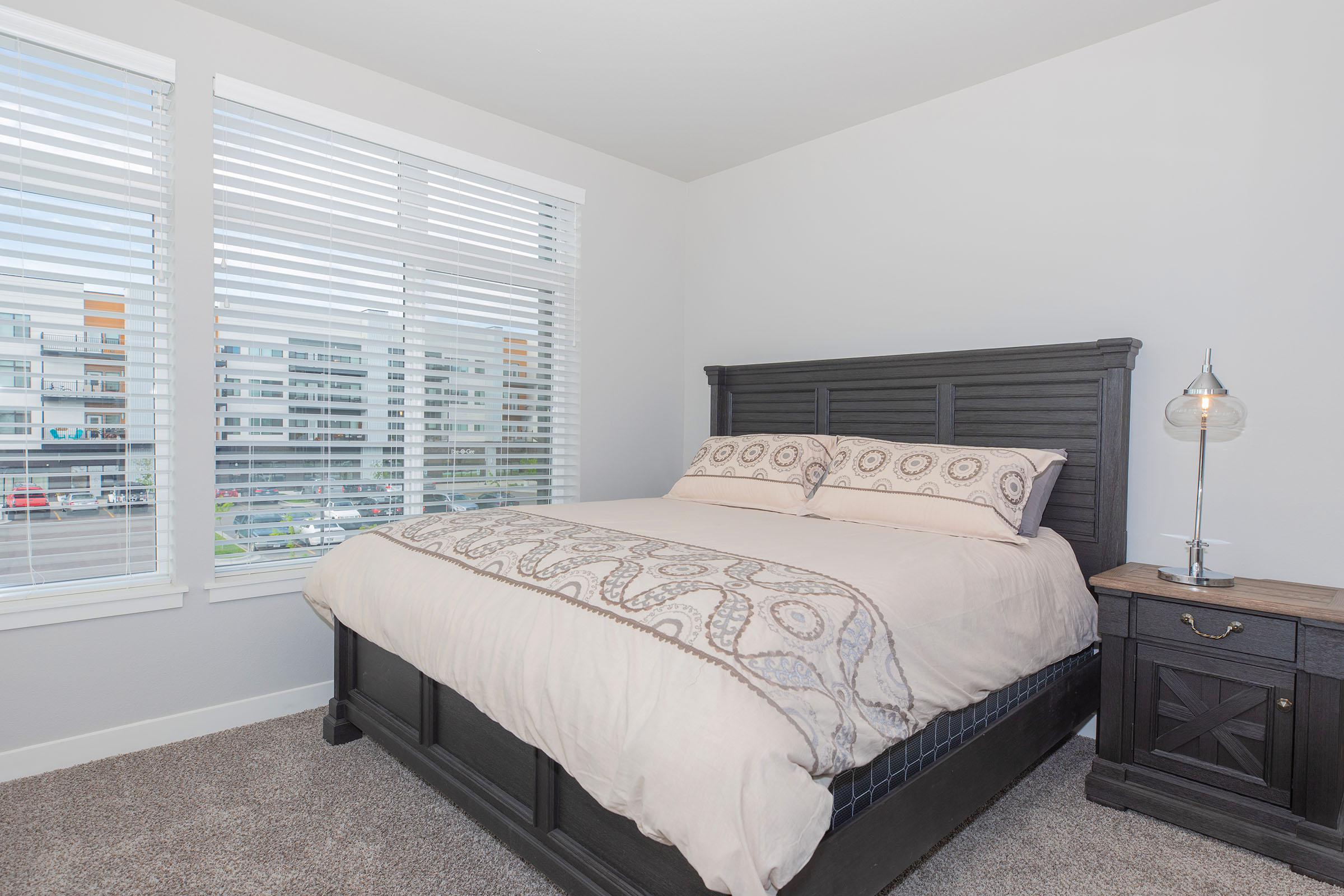 a bedroom with a large bed in a room