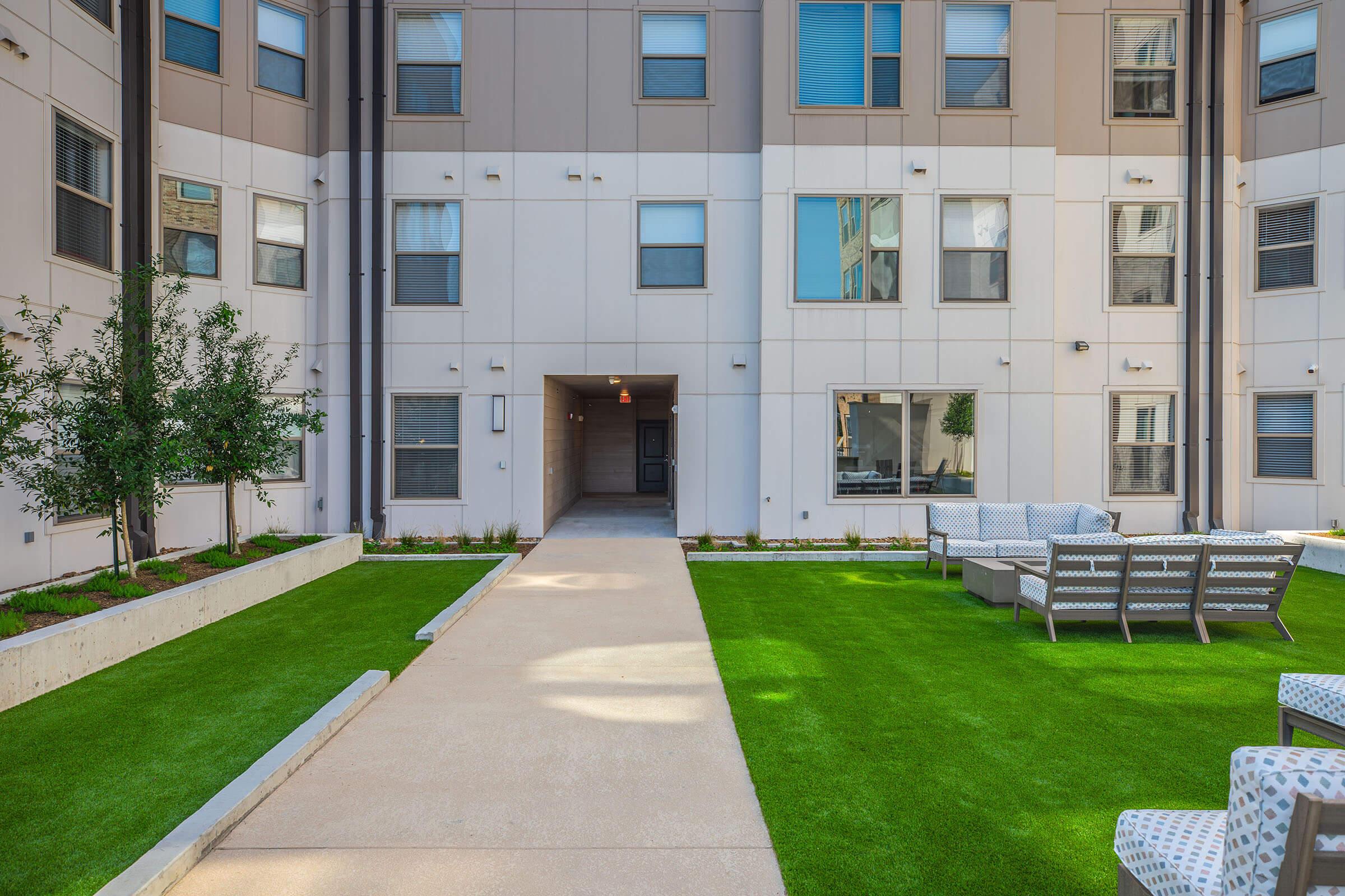 a large lawn in front of a building