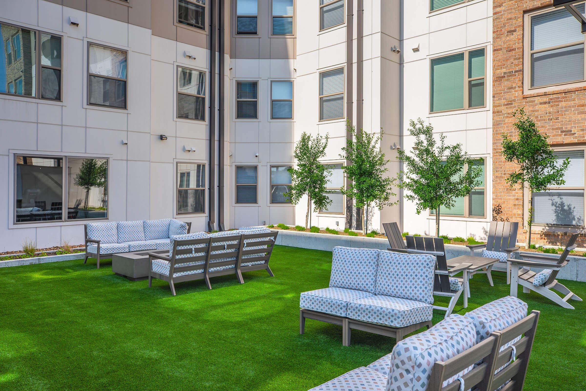 a couple of lawn chairs sitting on top of a building