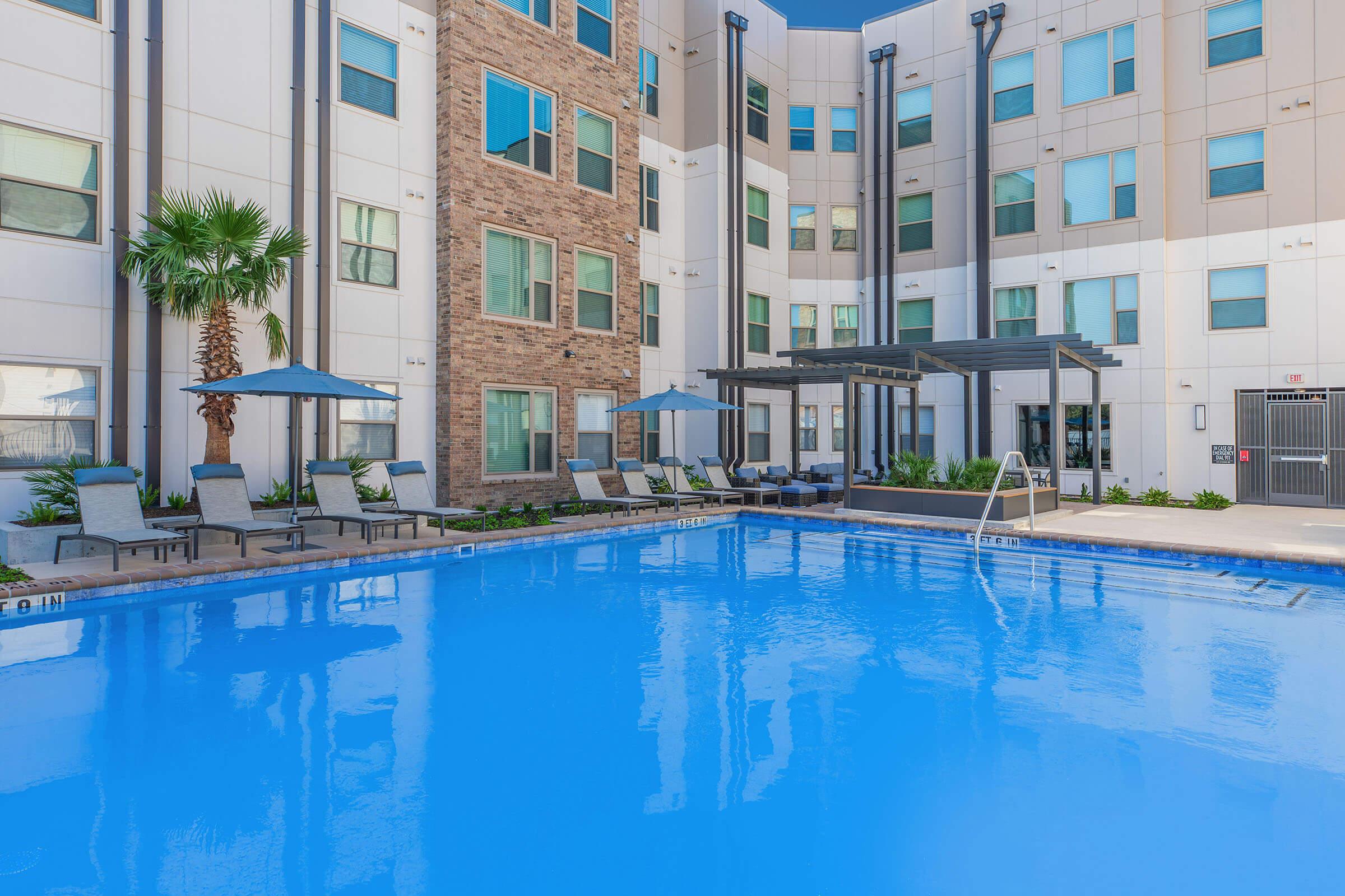 a large pool of water in front of a building