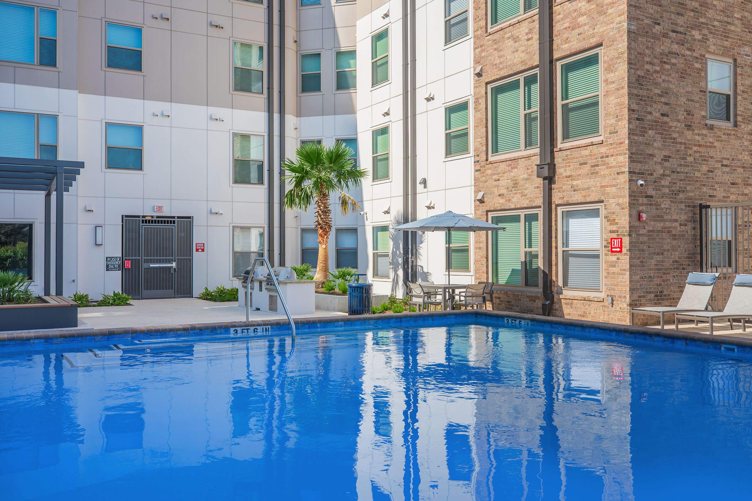 a large pool of water in front of a building