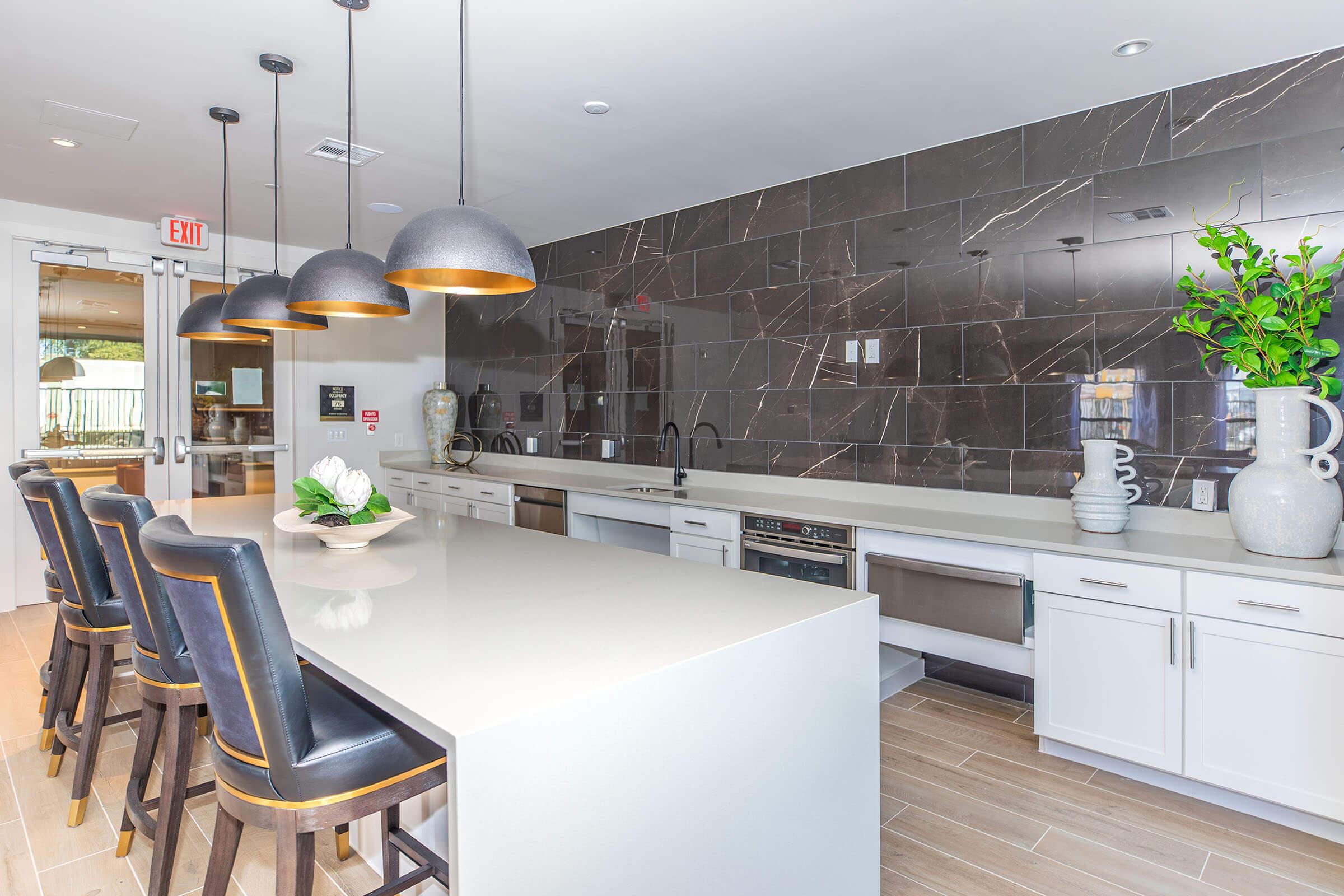 a kitchen with a table and chairs