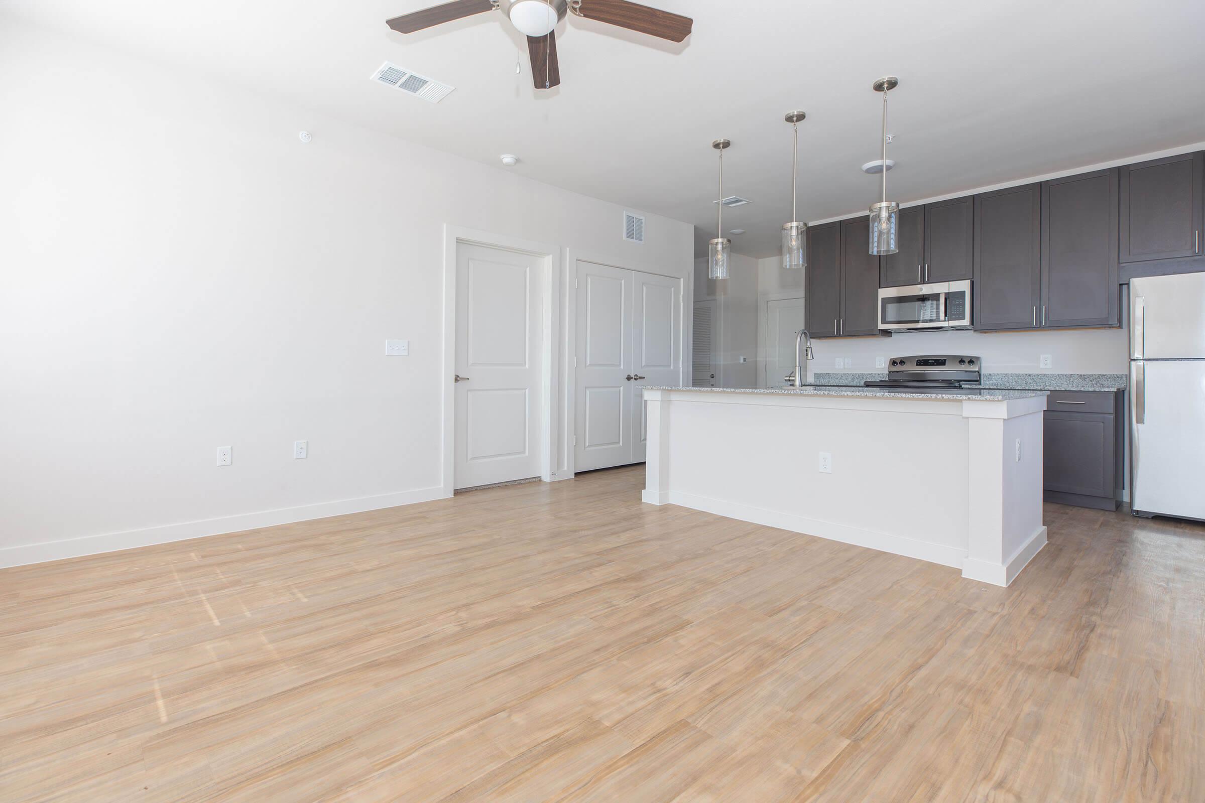 a kitchen with a wooden floor