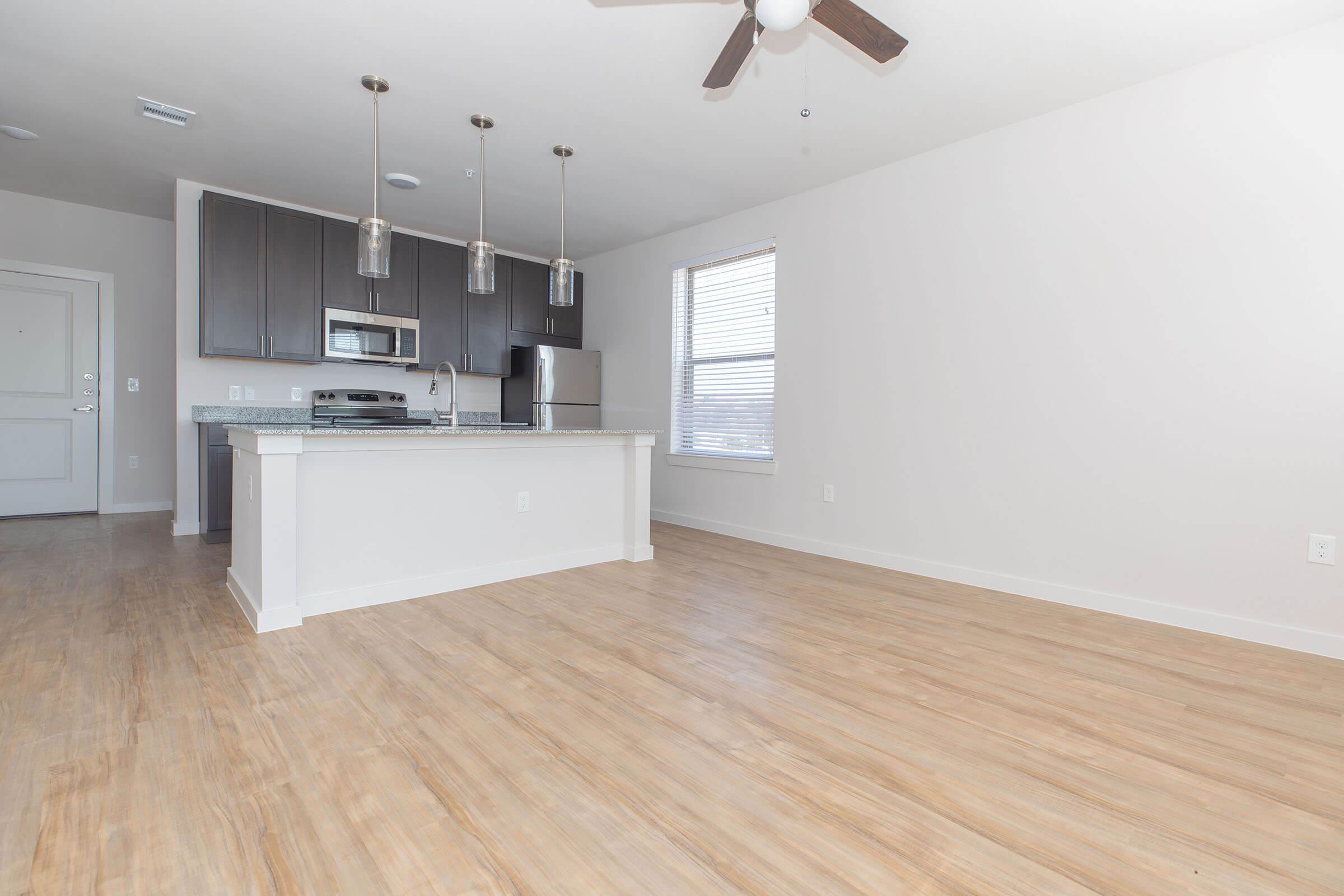 a kitchen with a wood floor