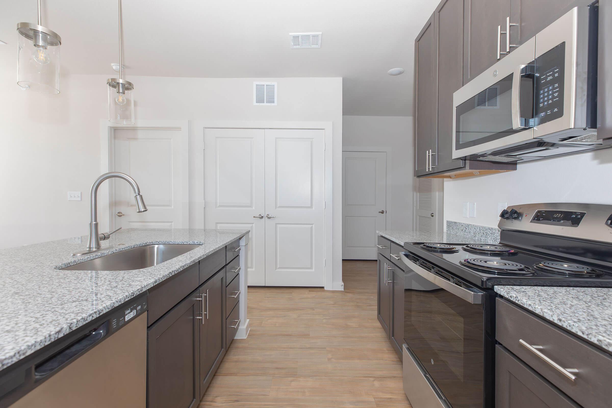 a kitchen with a stove and a sink