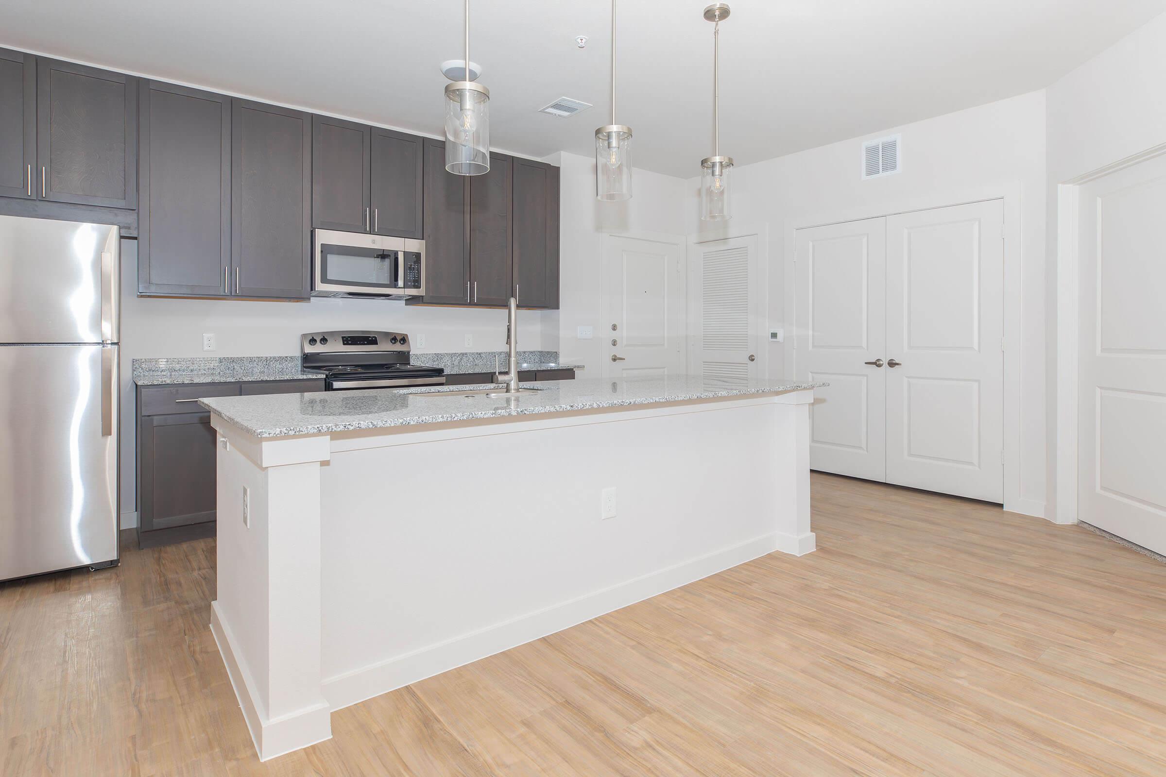 a kitchen with a wooden floor