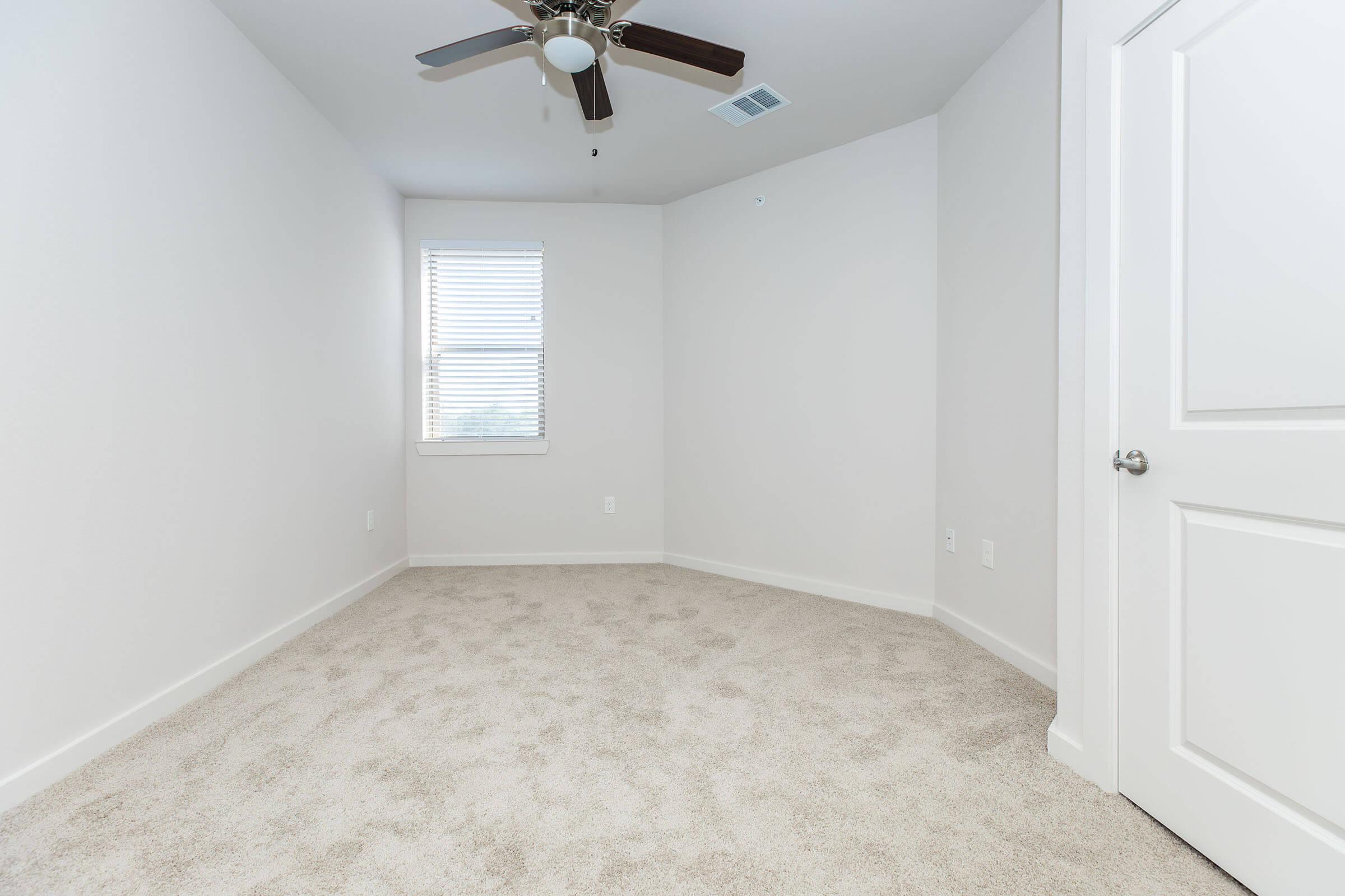 a room with a sink and a window