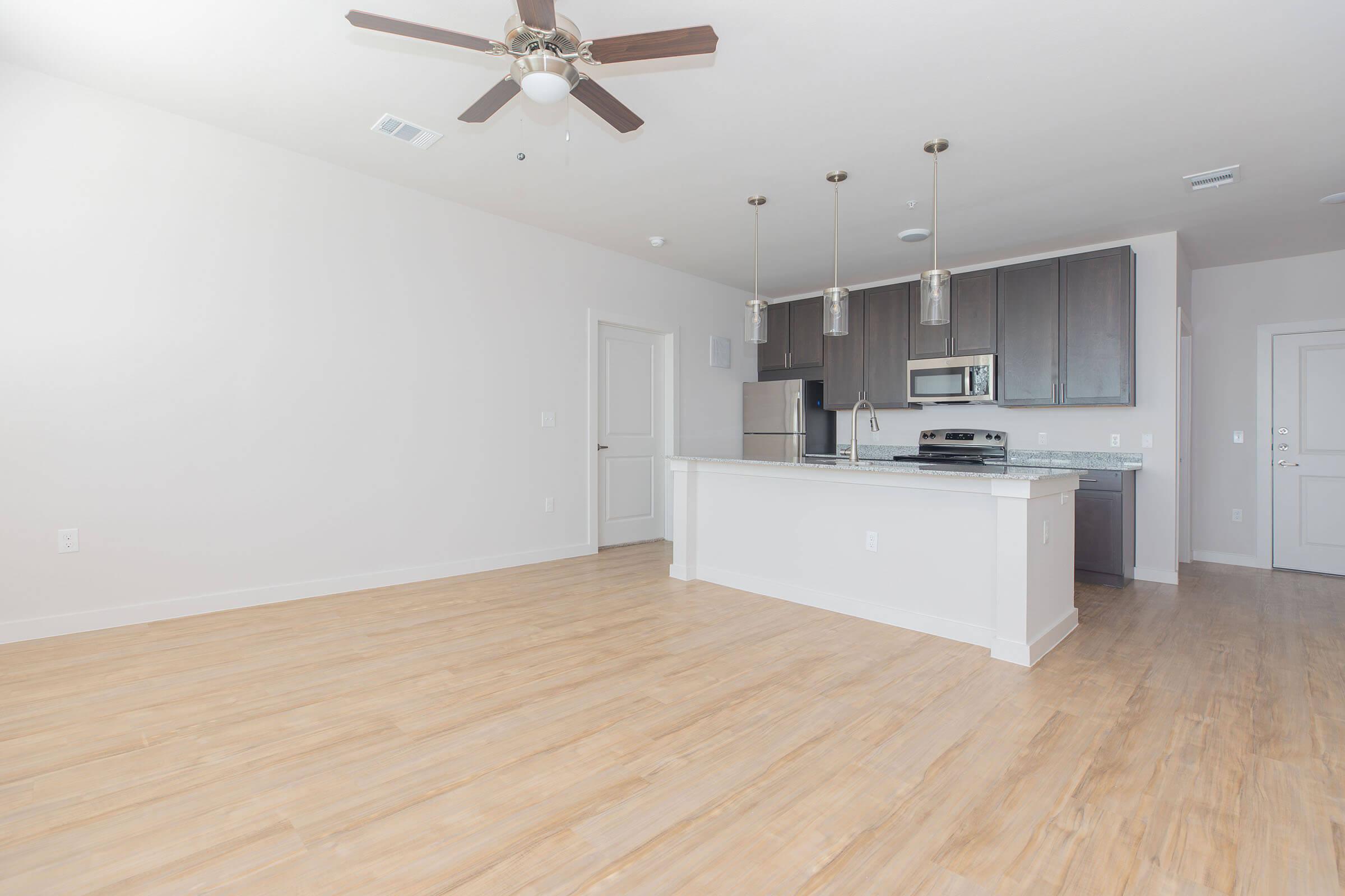 a kitchen with a wooden floor