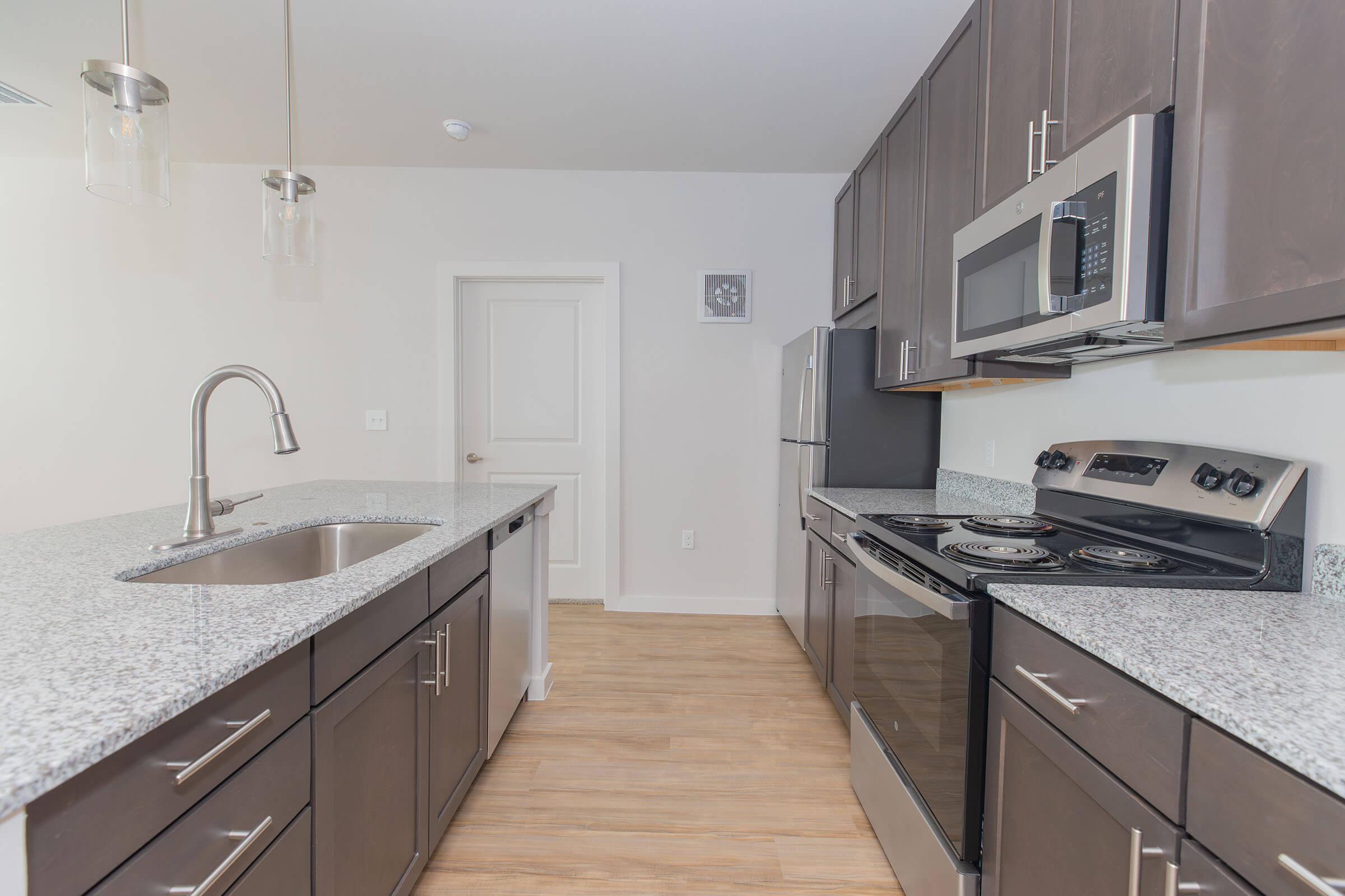 a kitchen with a stove and a sink