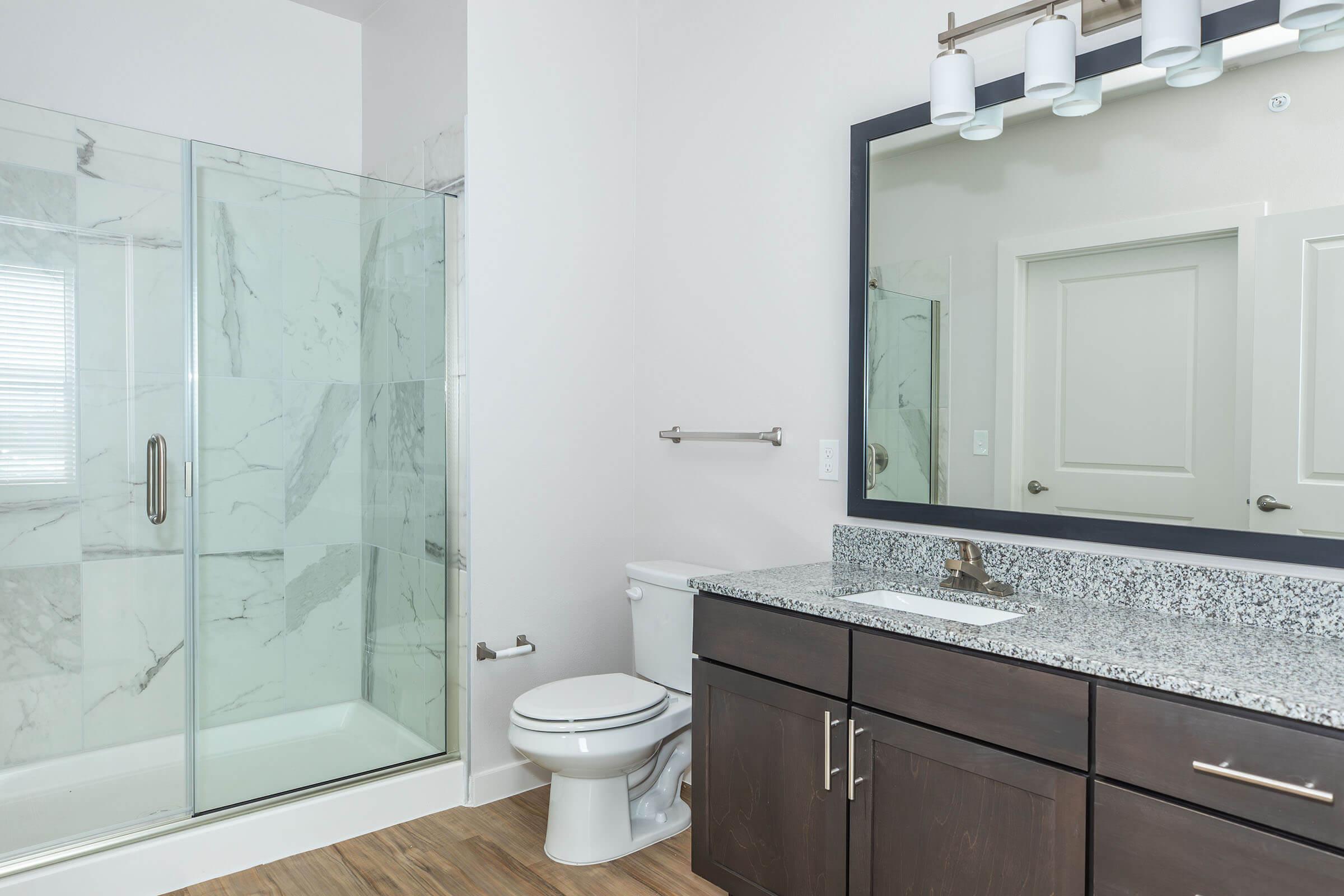 a room with a sink and a shower