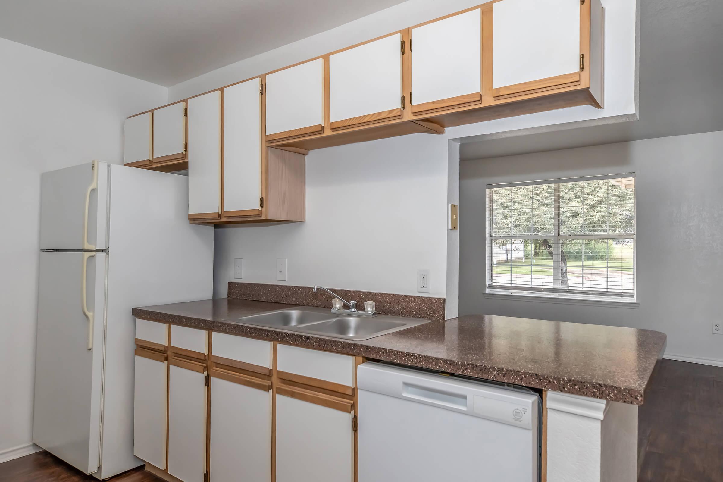 a kitchen with a sink and a window