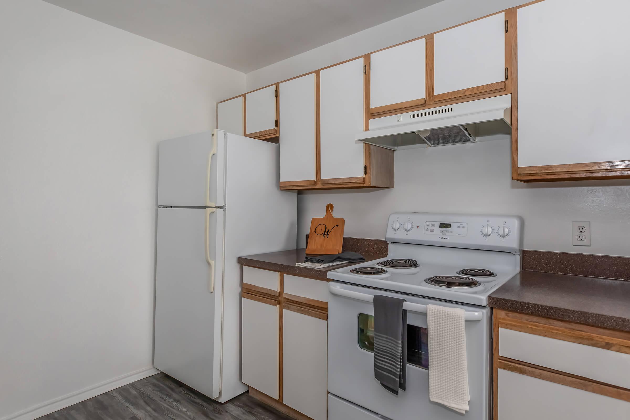 a kitchen with a sink and a mirror