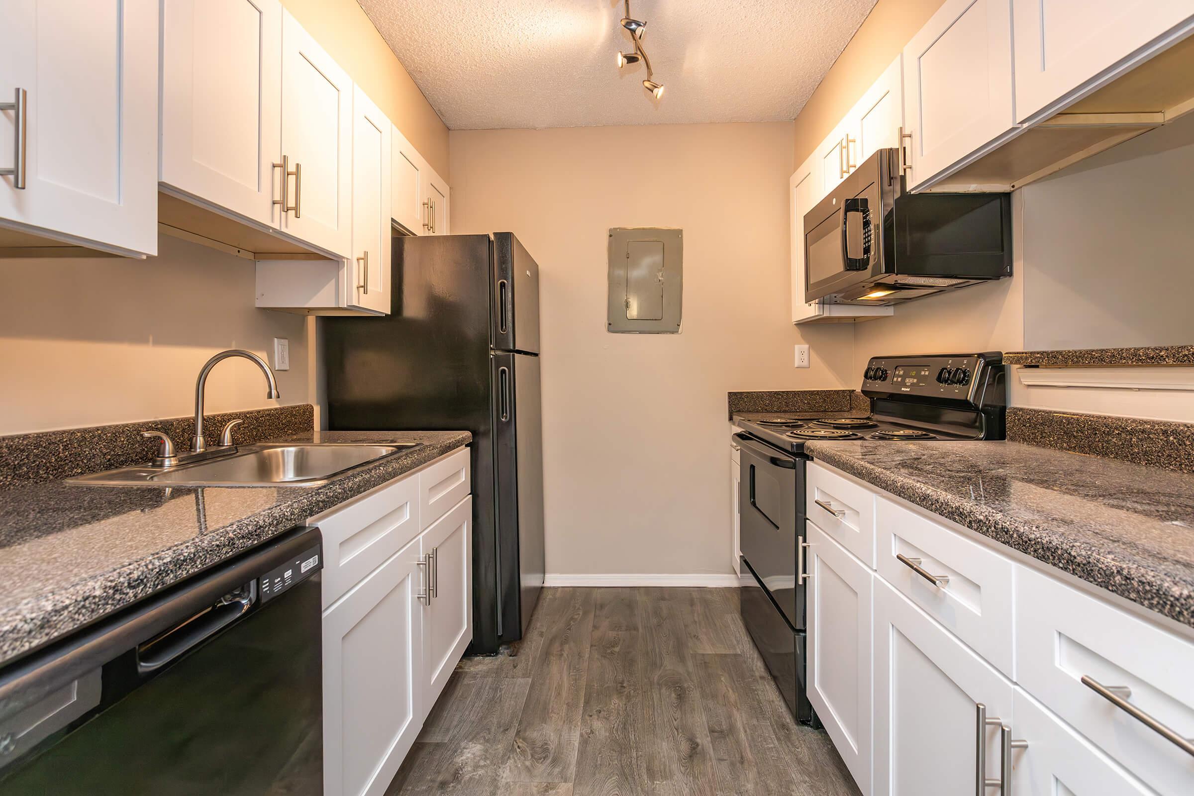 a modern kitchen with stainless steel appliances