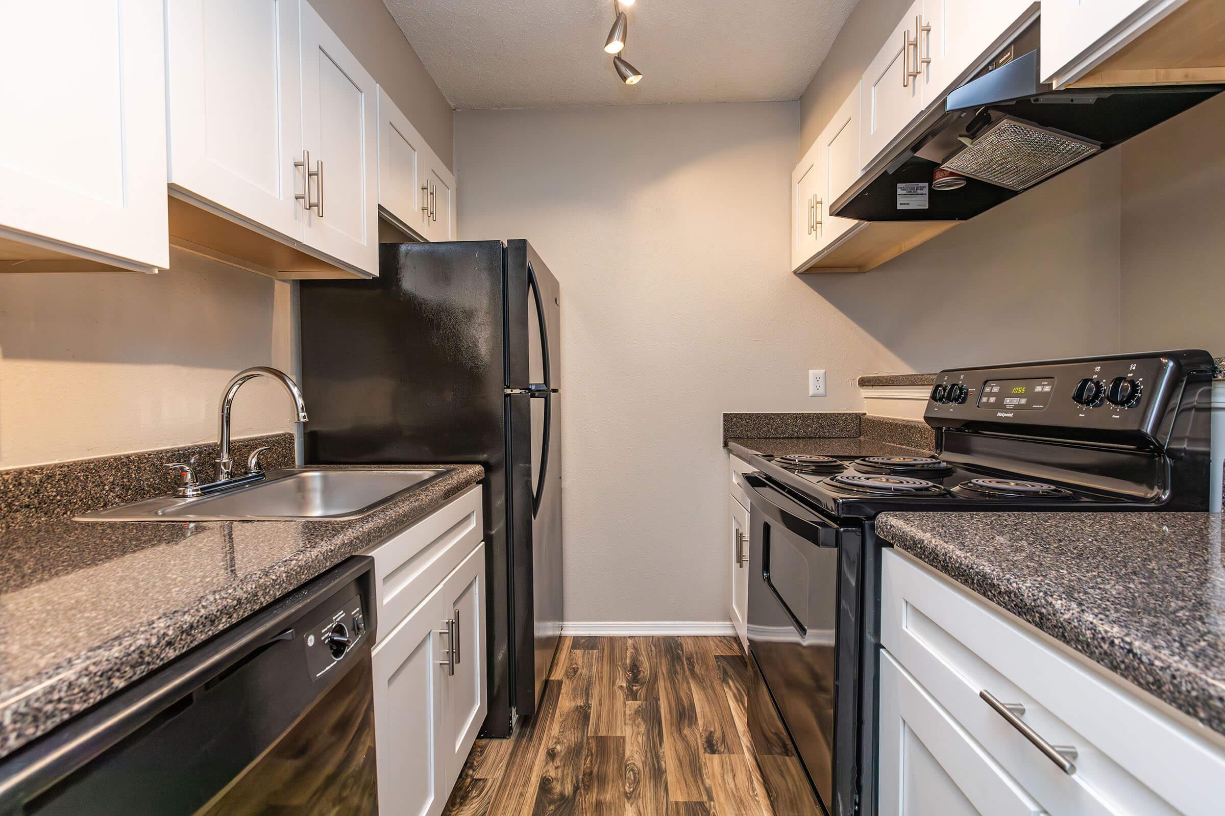 a modern kitchen with stainless steel appliances