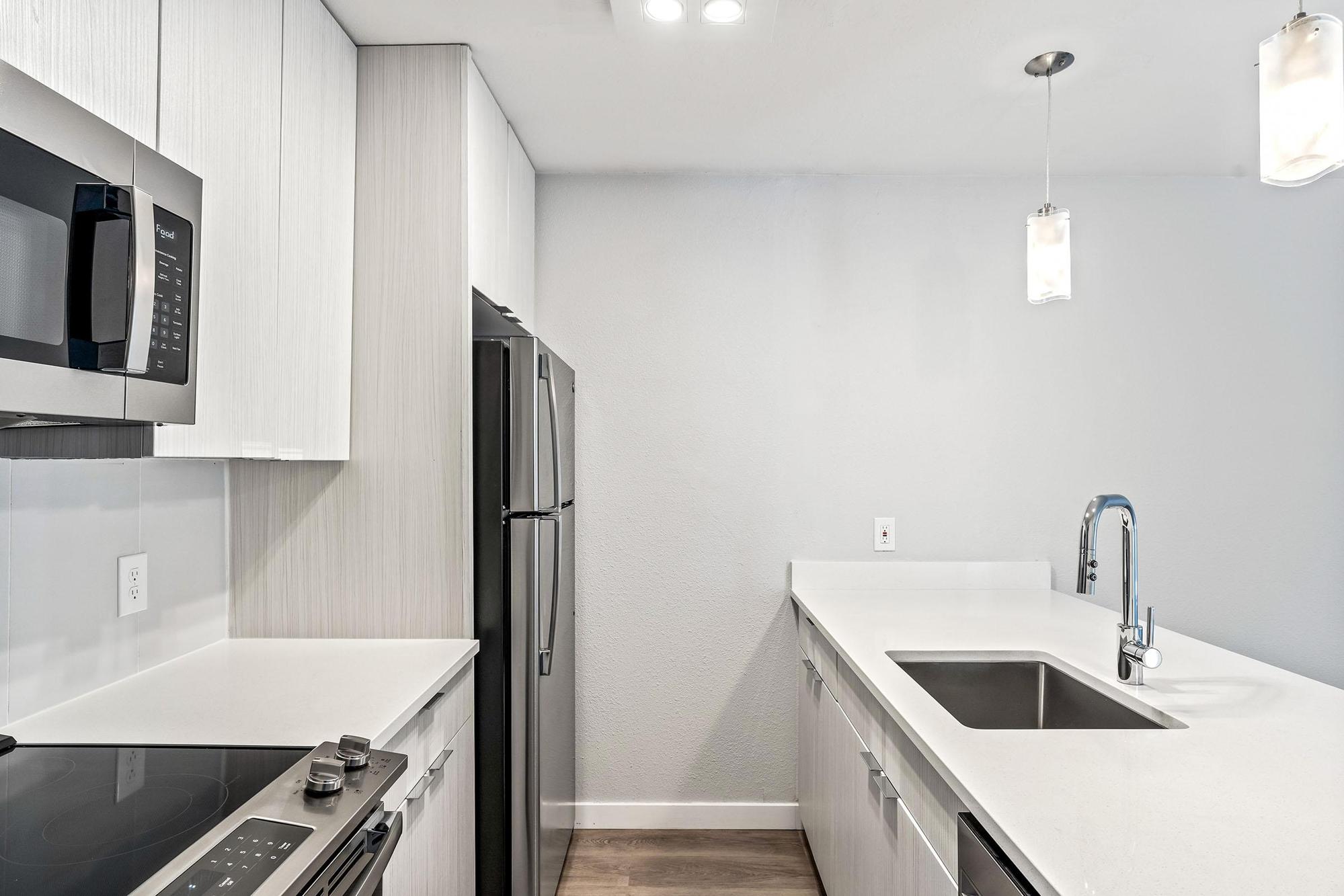 a kitchen with a stove and a sink