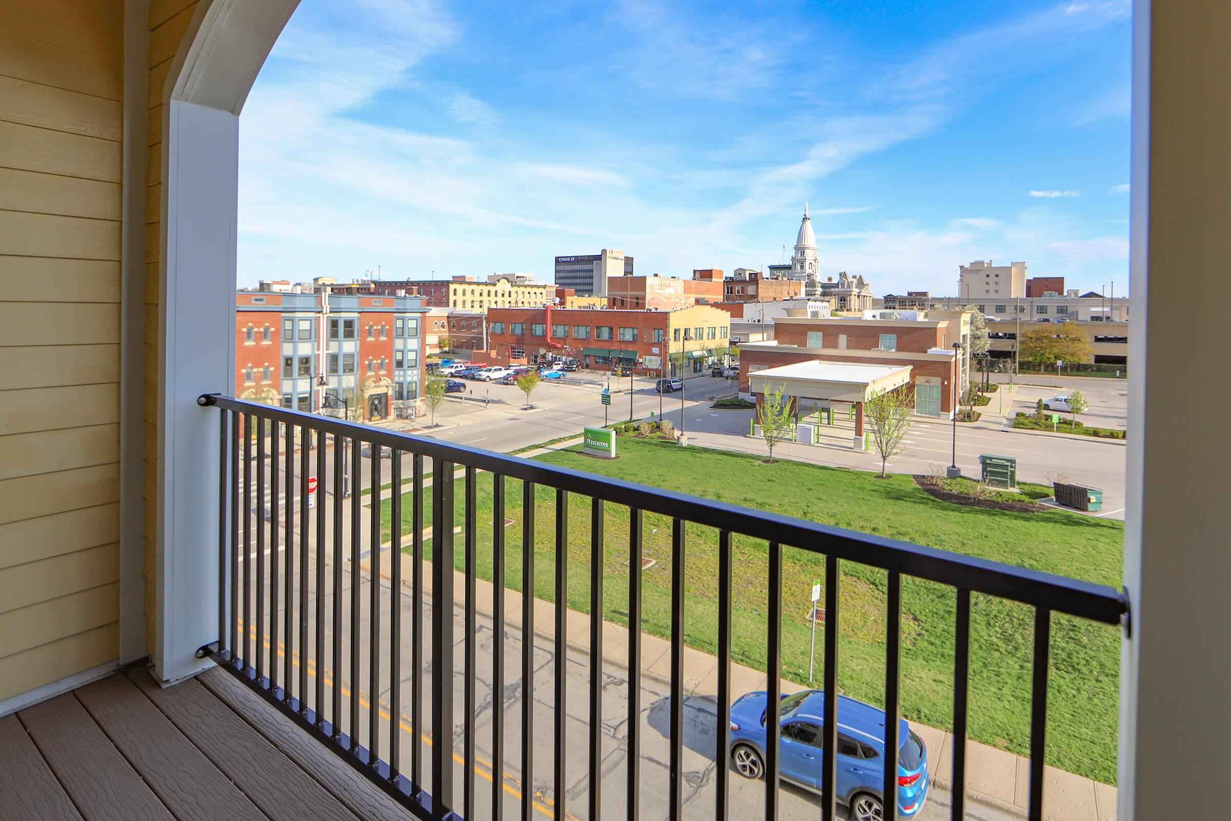 a view of a city next to a fence