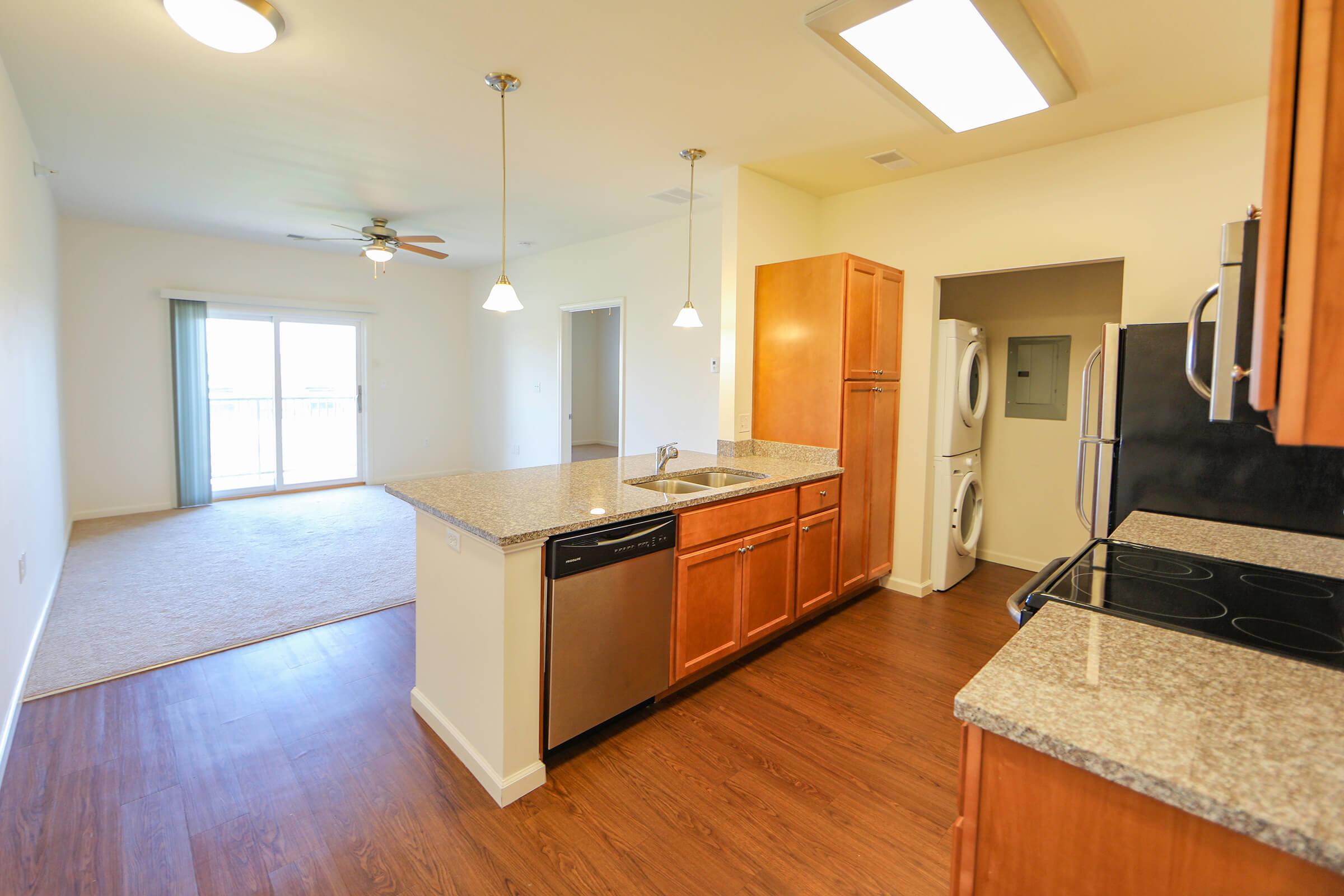 a kitchen with a wood floor