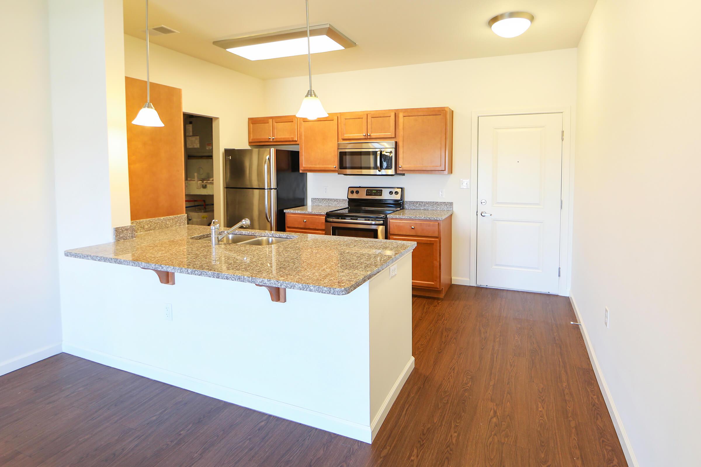 a kitchen with a wood floor