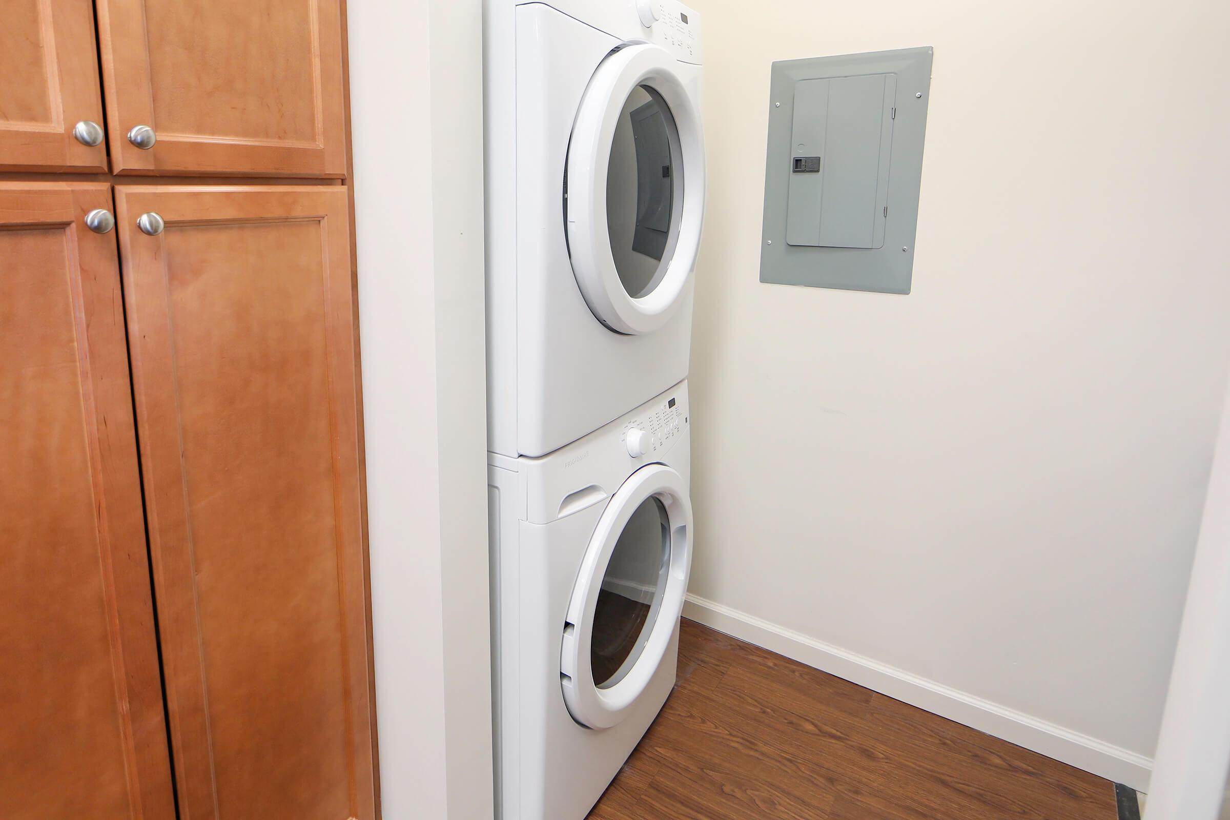 a microwave oven sitting on top of a refrigerator