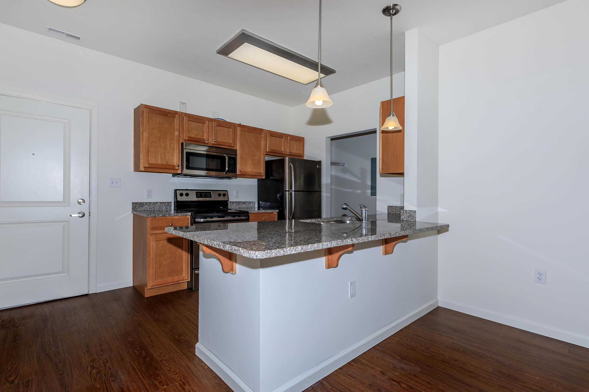 a kitchen with a tile floor