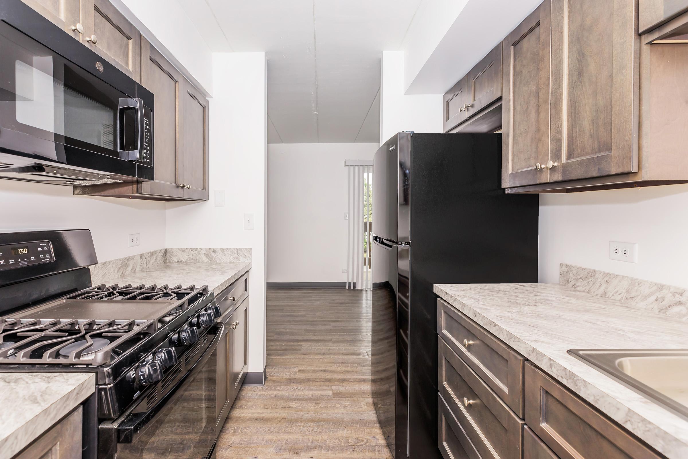 a kitchen with a stove top oven