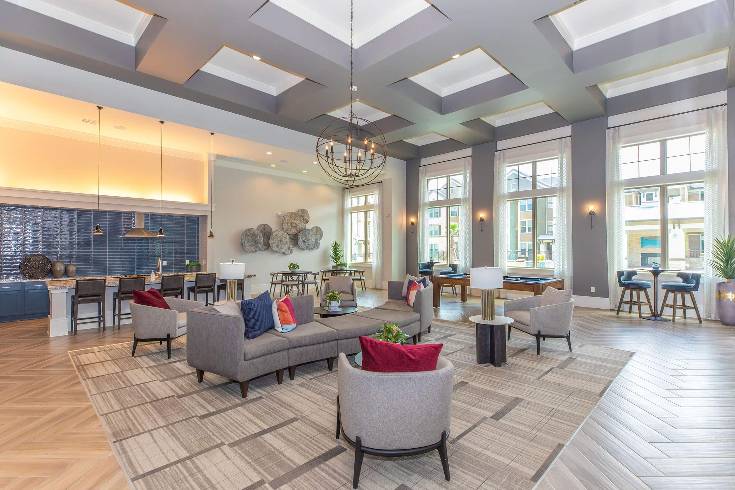 a living room filled with furniture and a large window