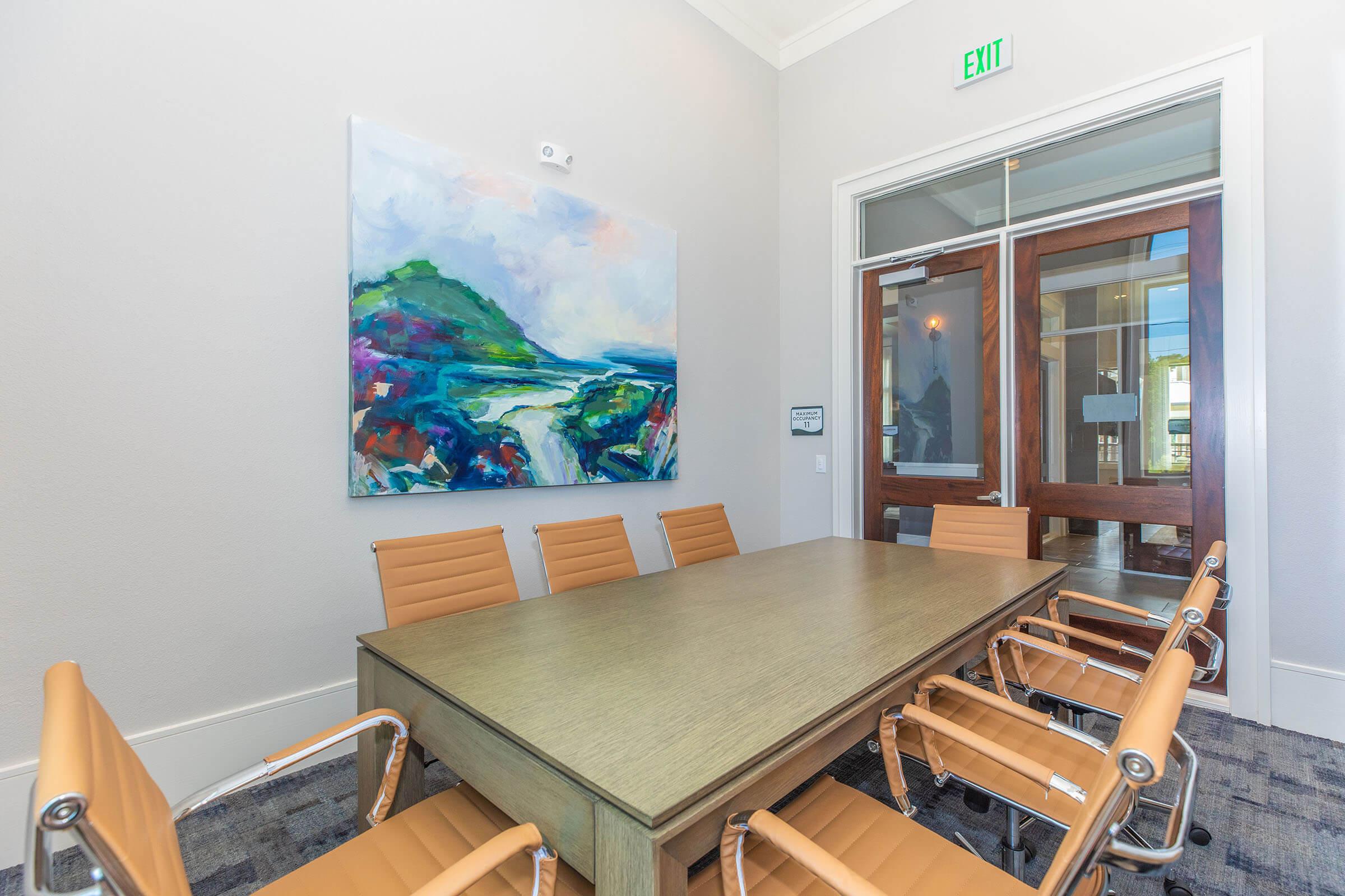 a dining room table in front of a window