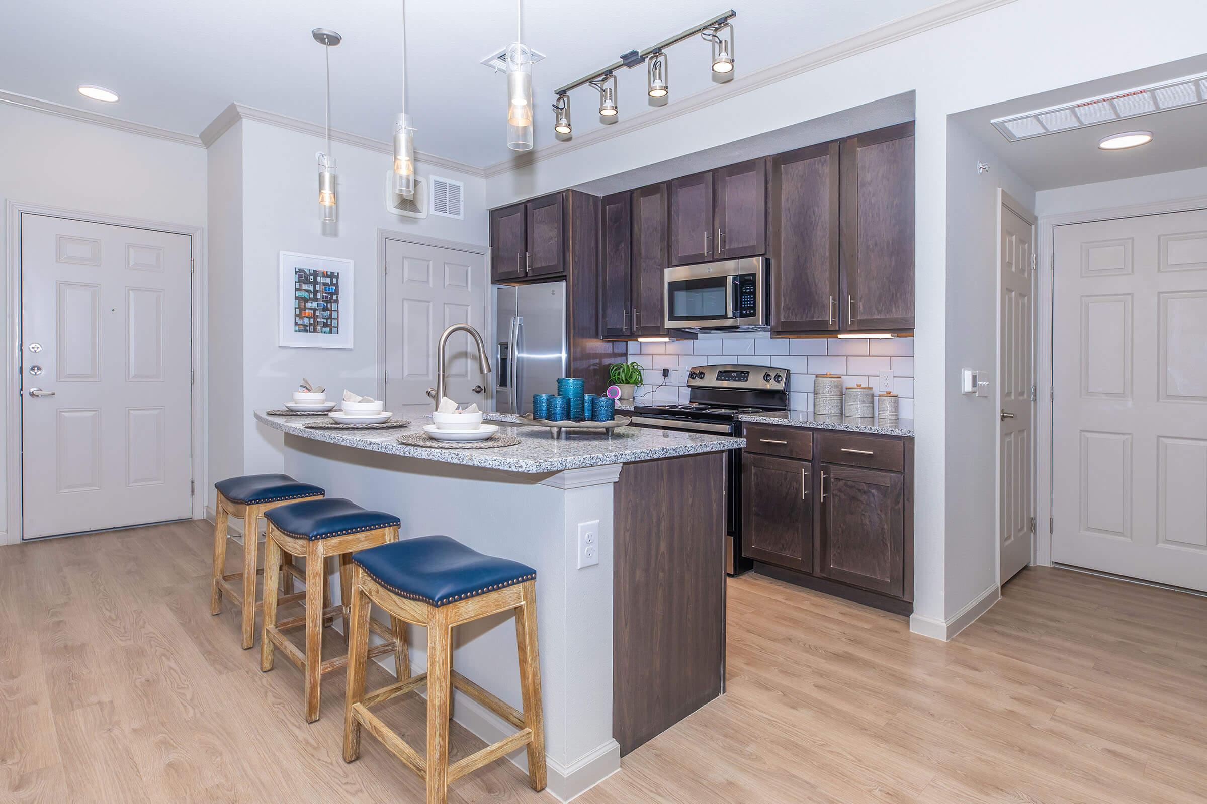 a kitchen with a wooden floor