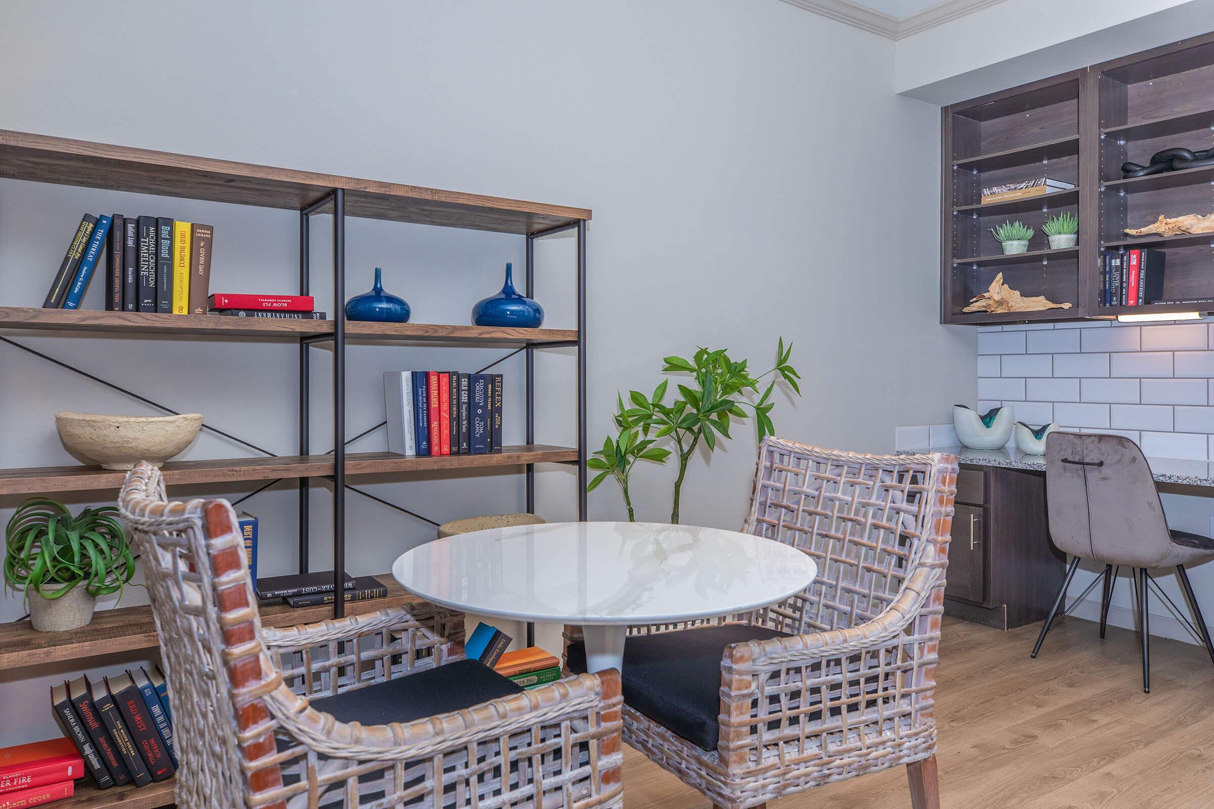 a room filled with furniture and vase on a table