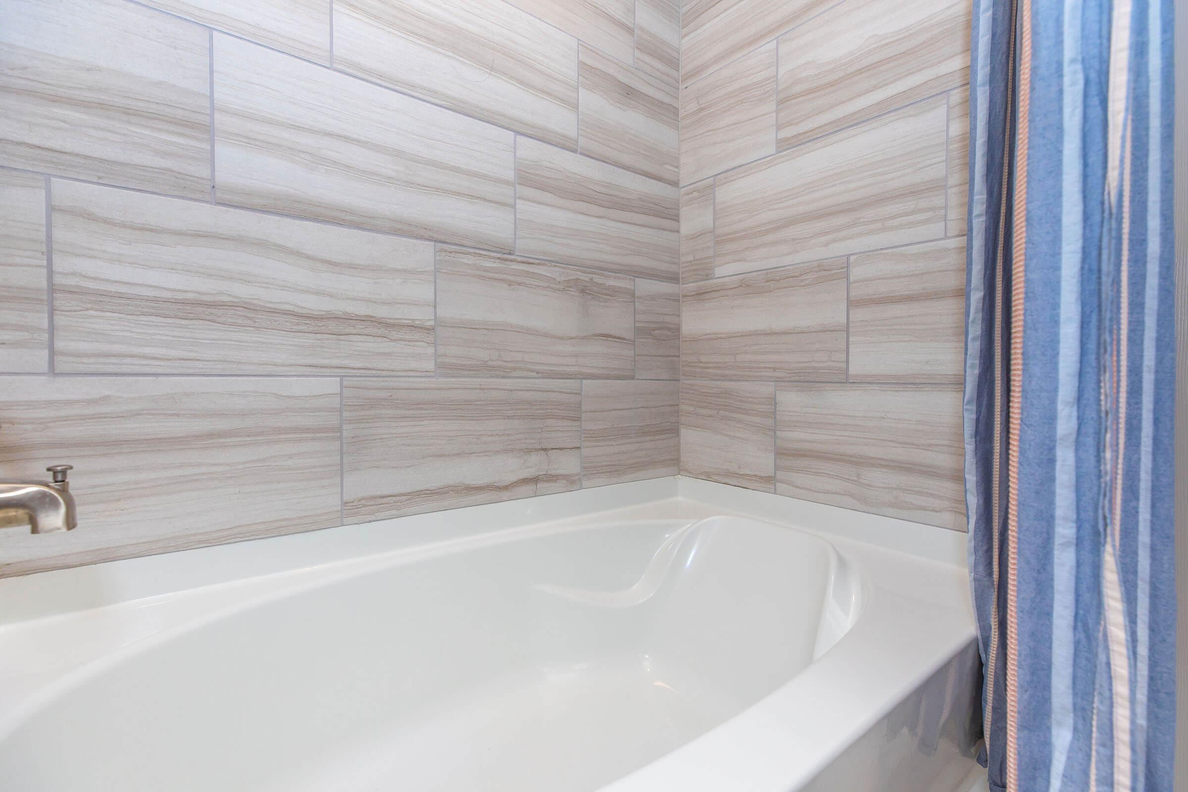 a close up of a sink and a bath tub