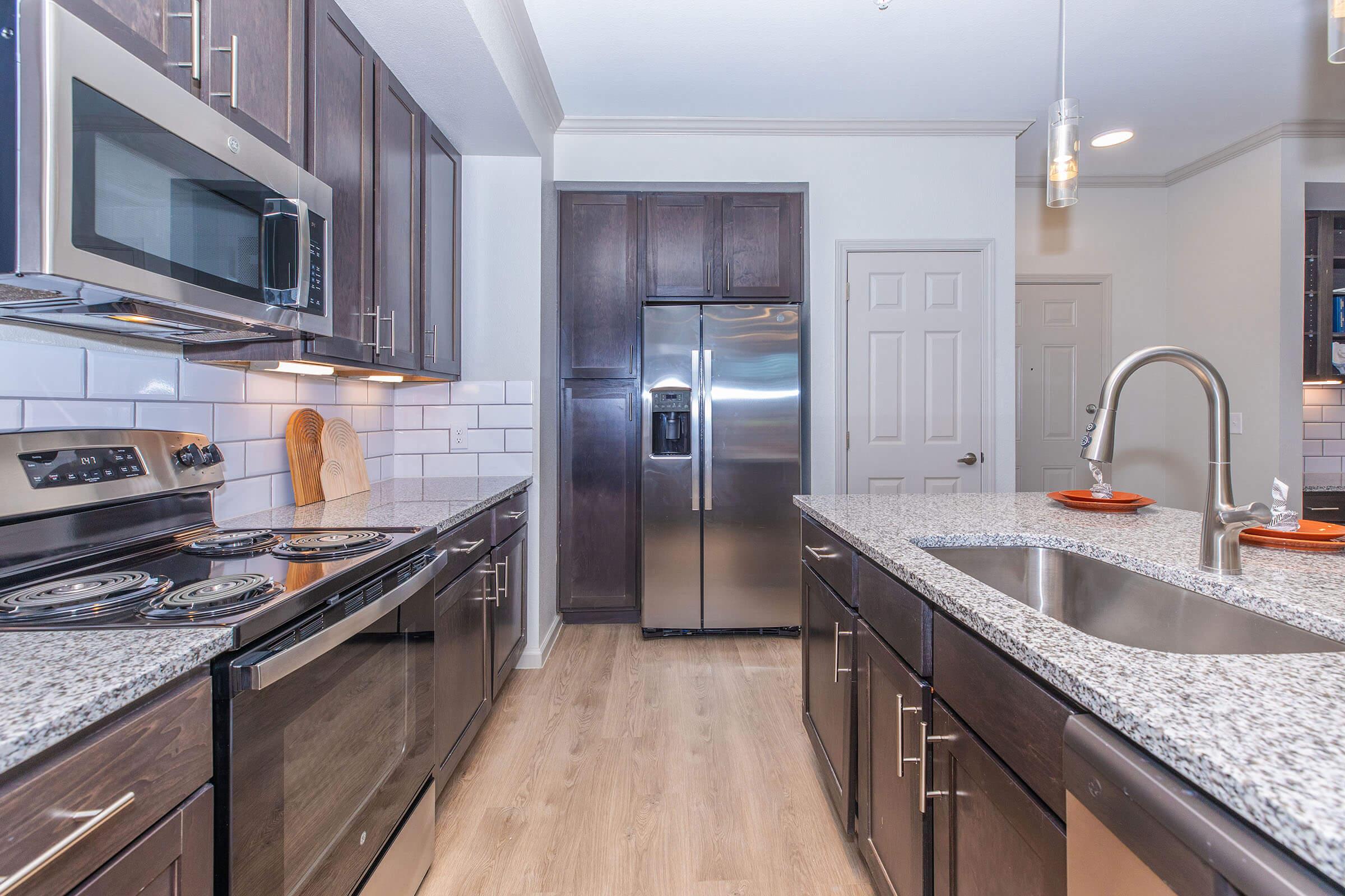 a modern kitchen with stainless steel appliances