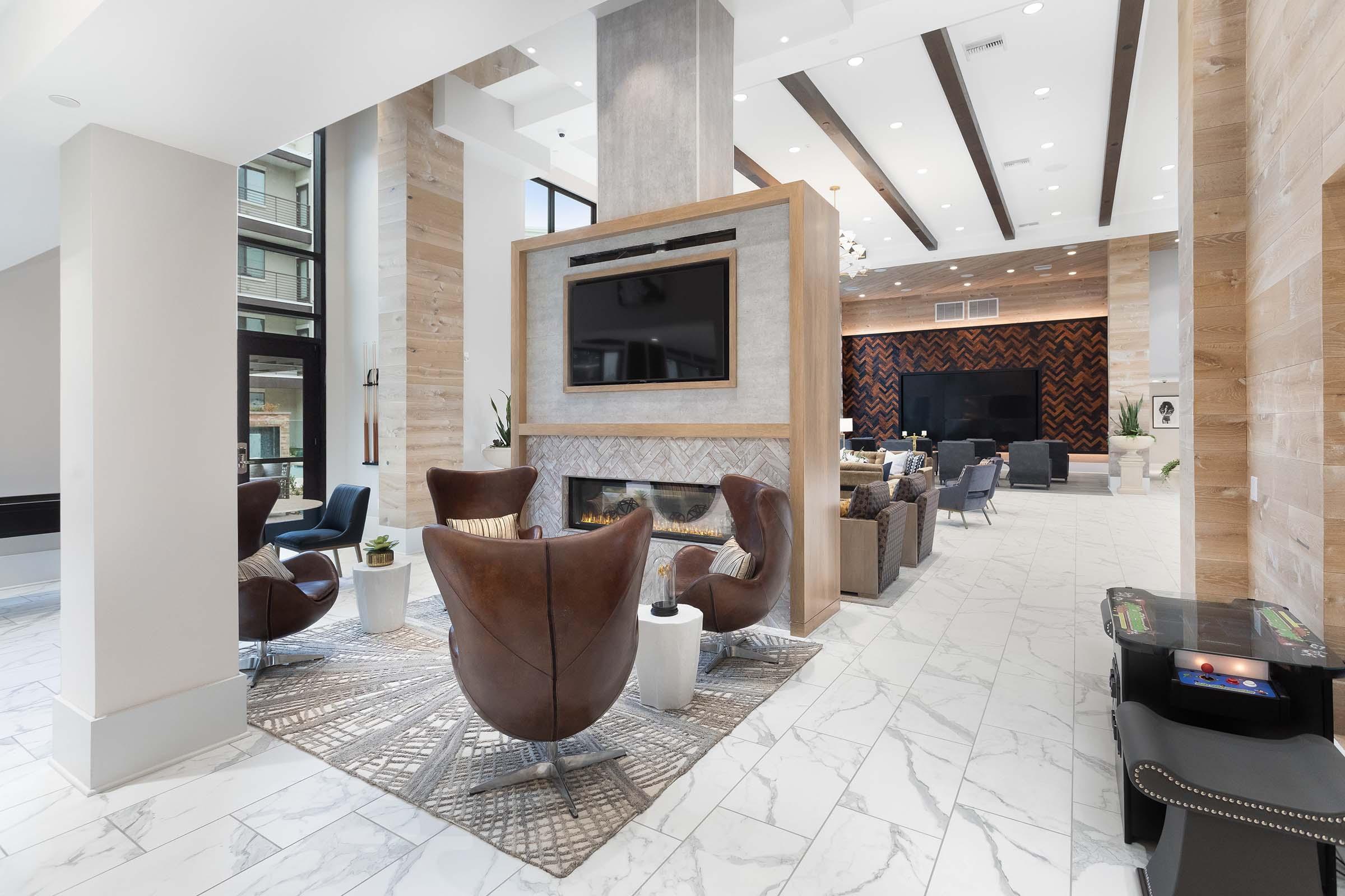 a living room filled with furniture and a fire place