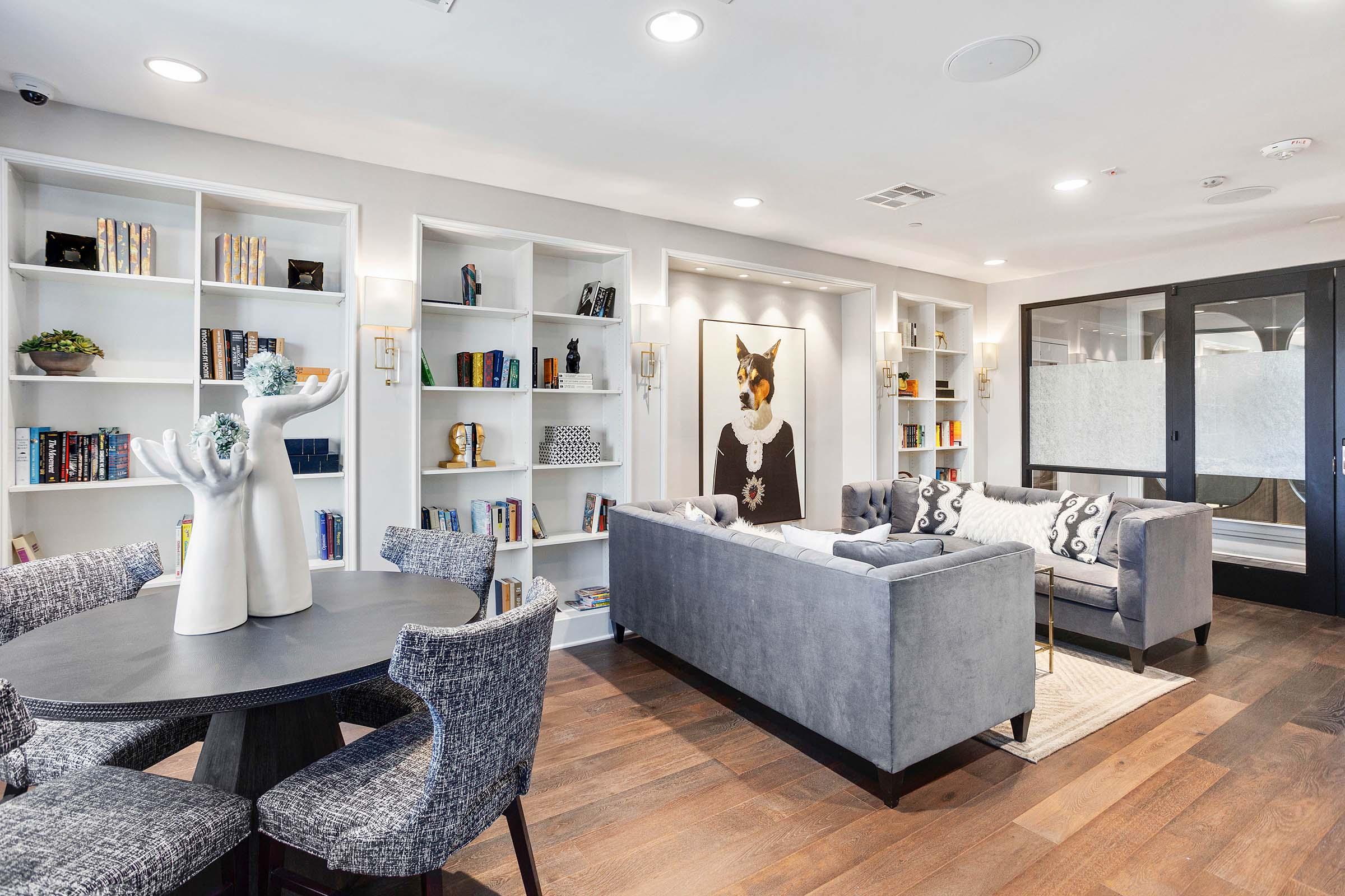 a living room filled with furniture and a large mirror