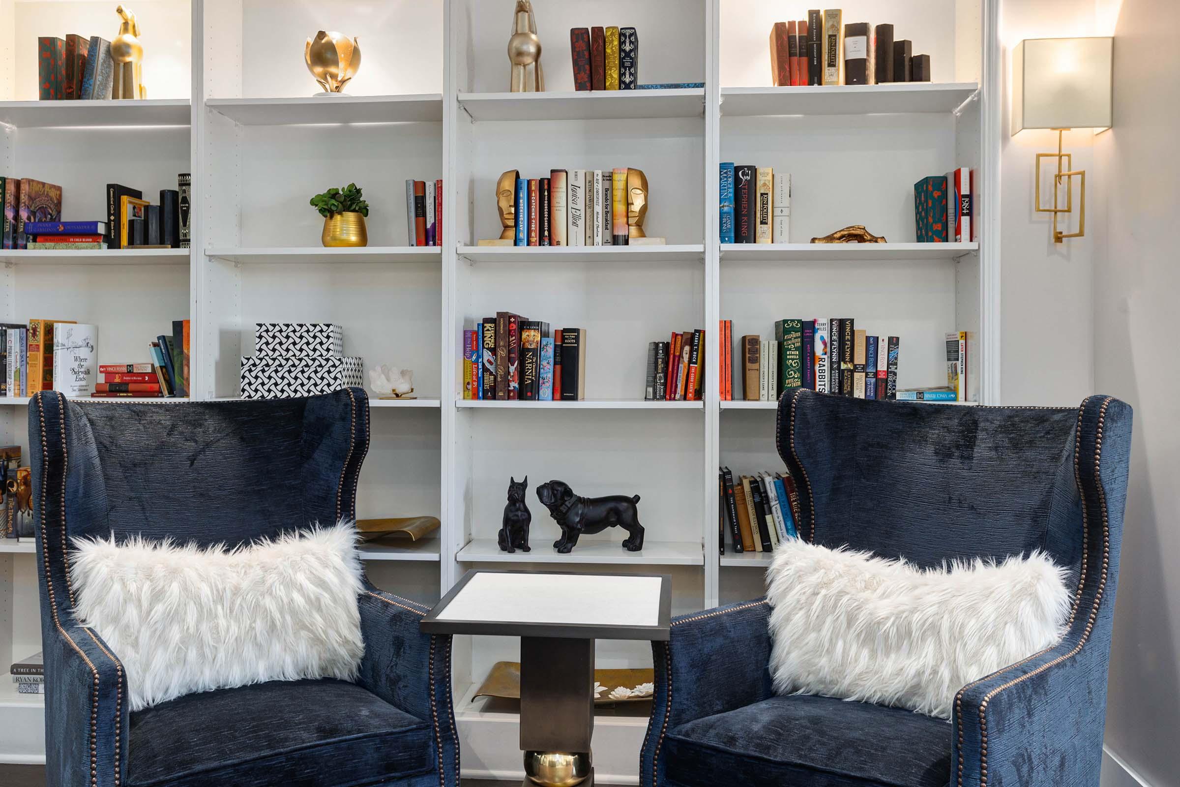 a living room with a book shelf