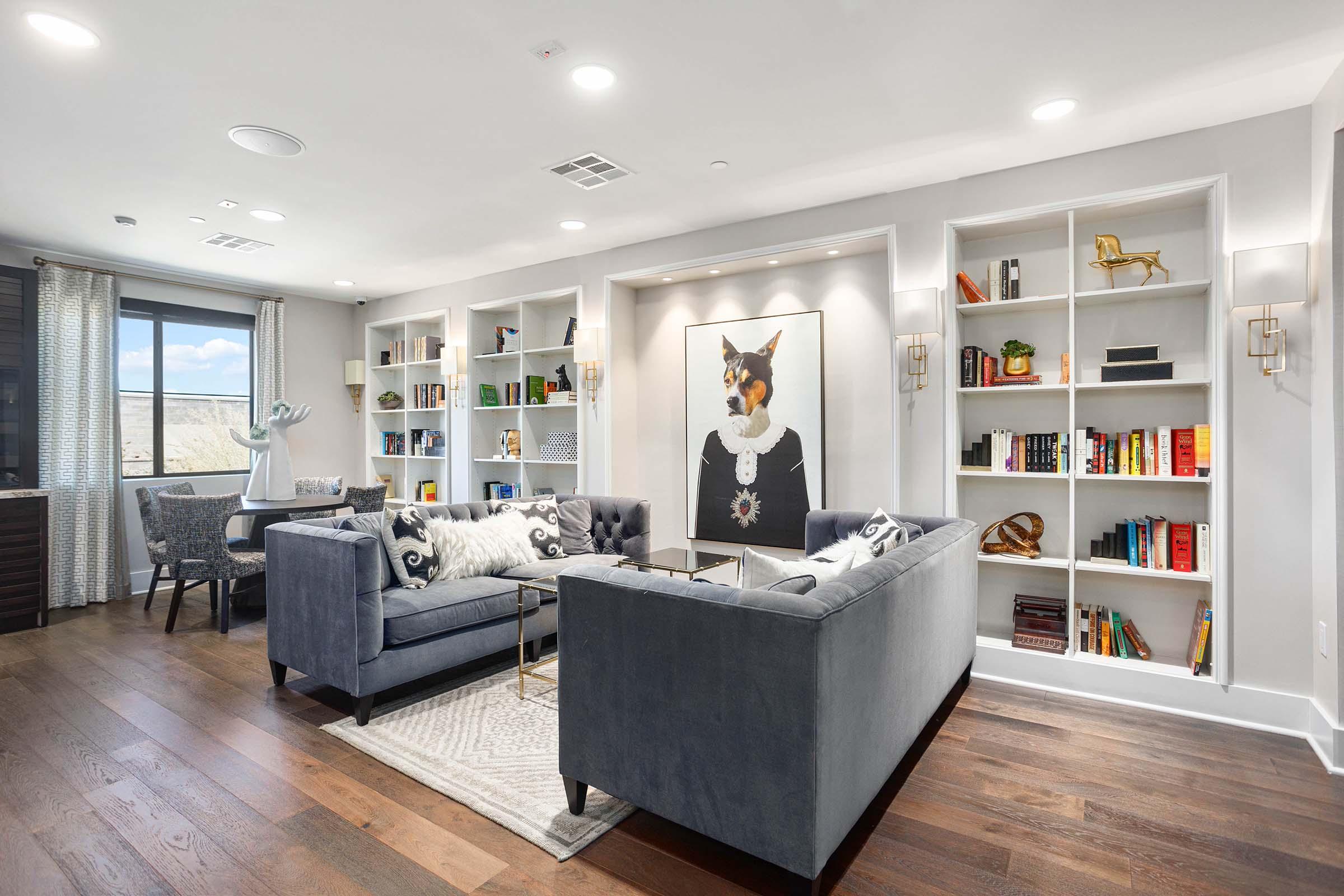 a living room filled with furniture and a tv