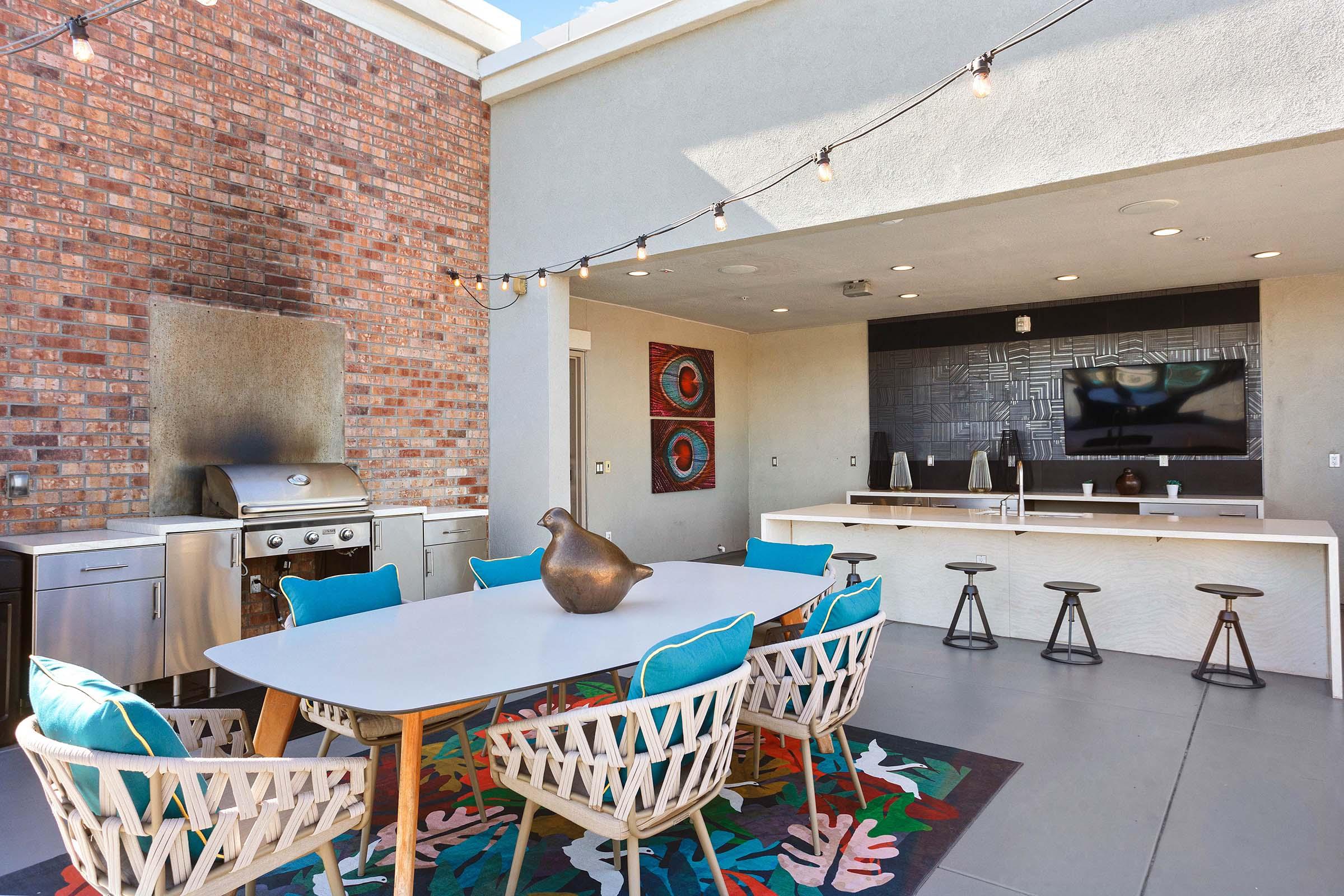 a kitchen with a table and chairs