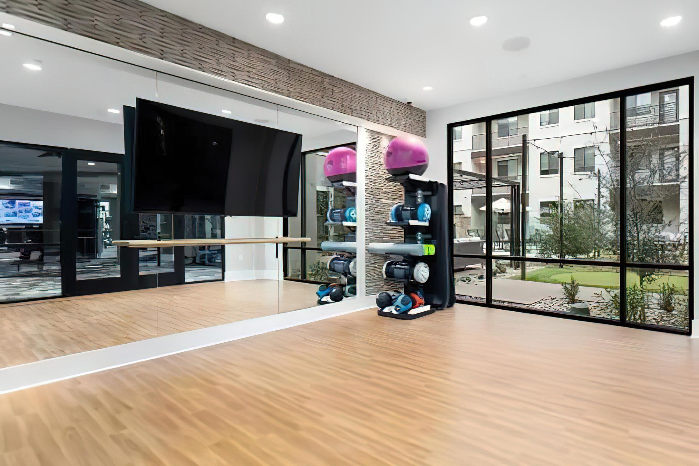 a living room filled with furniture and a large window