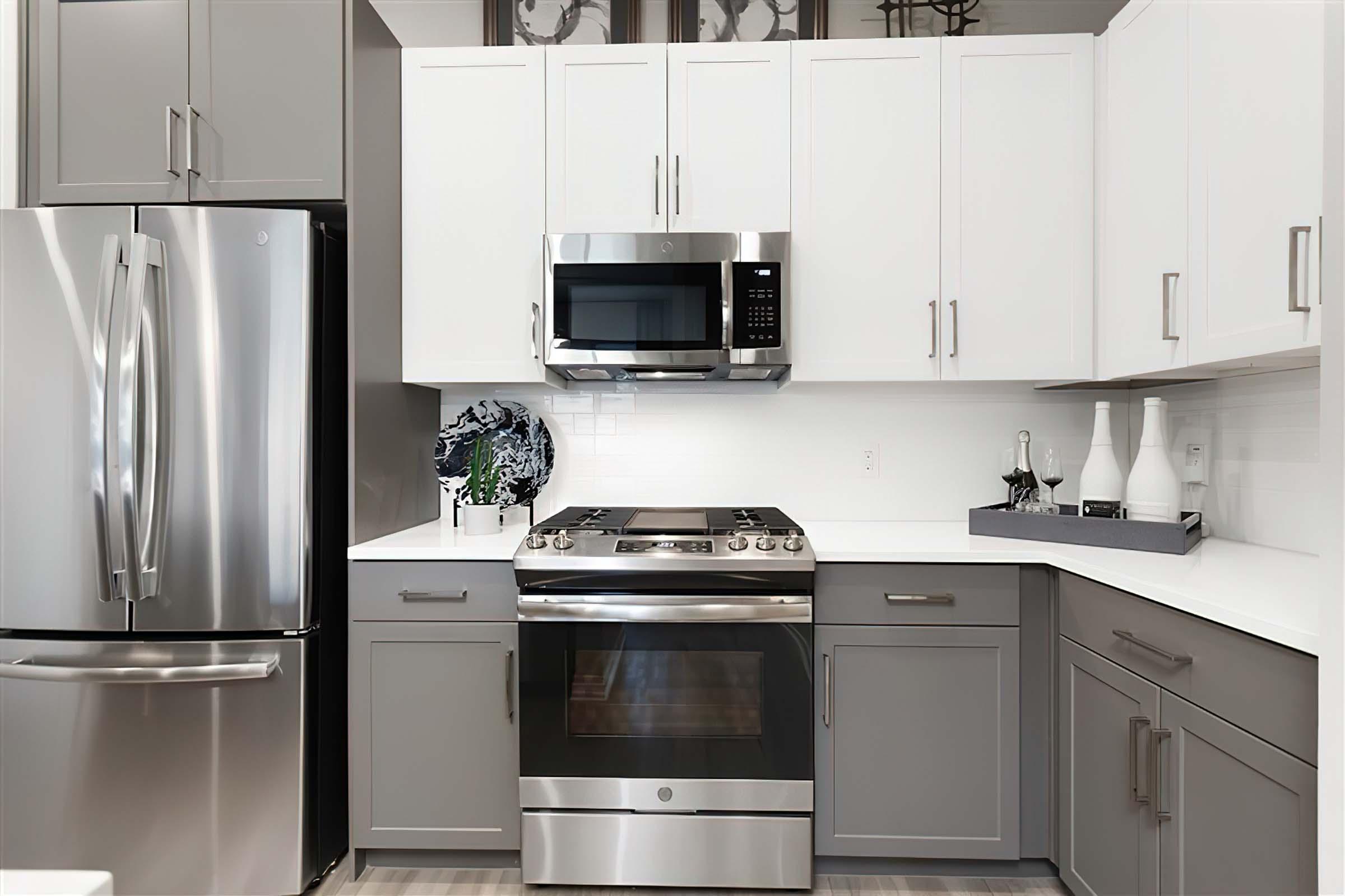 a kitchen with a stove microwave and refrigerator