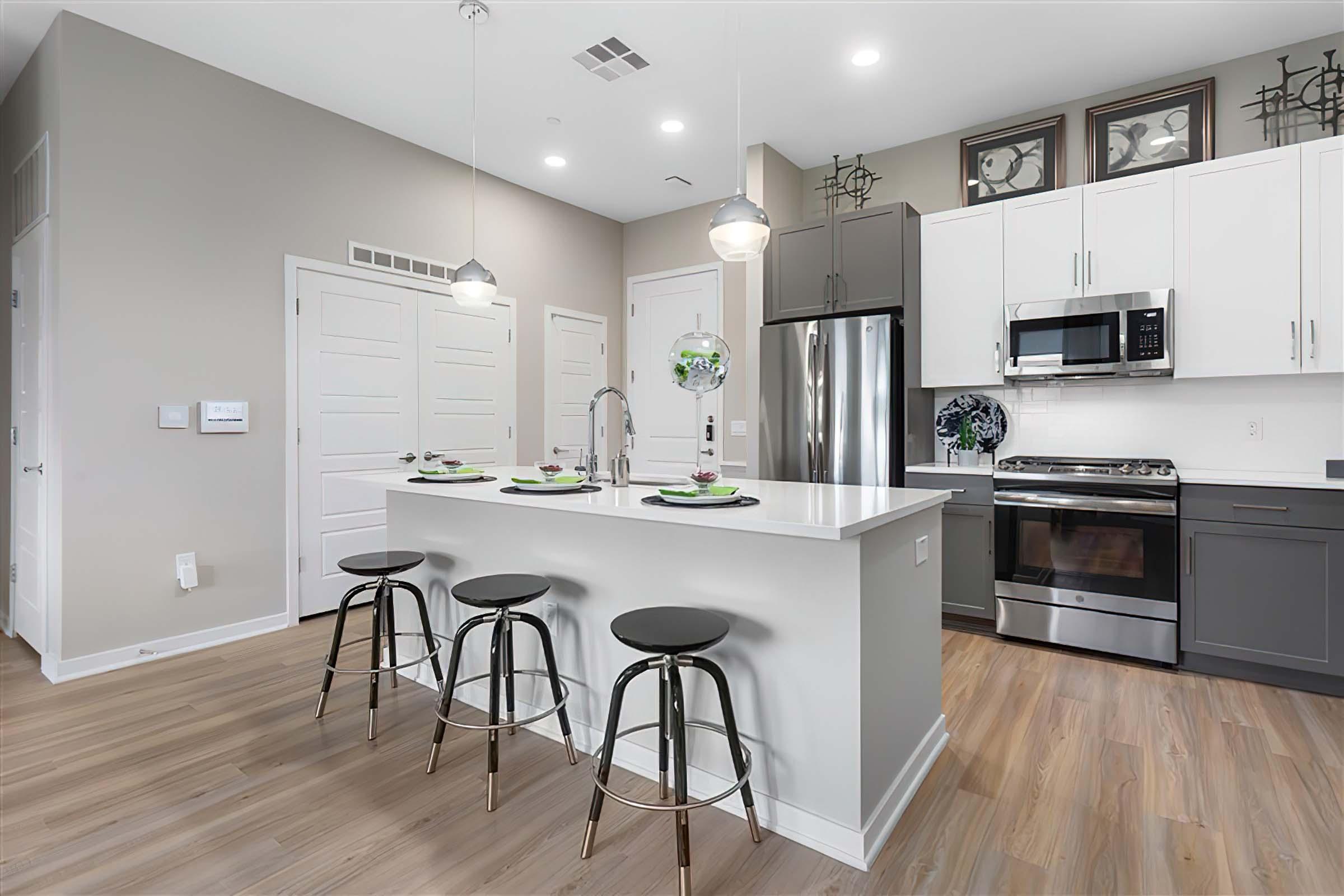 a kitchen with a wood floor