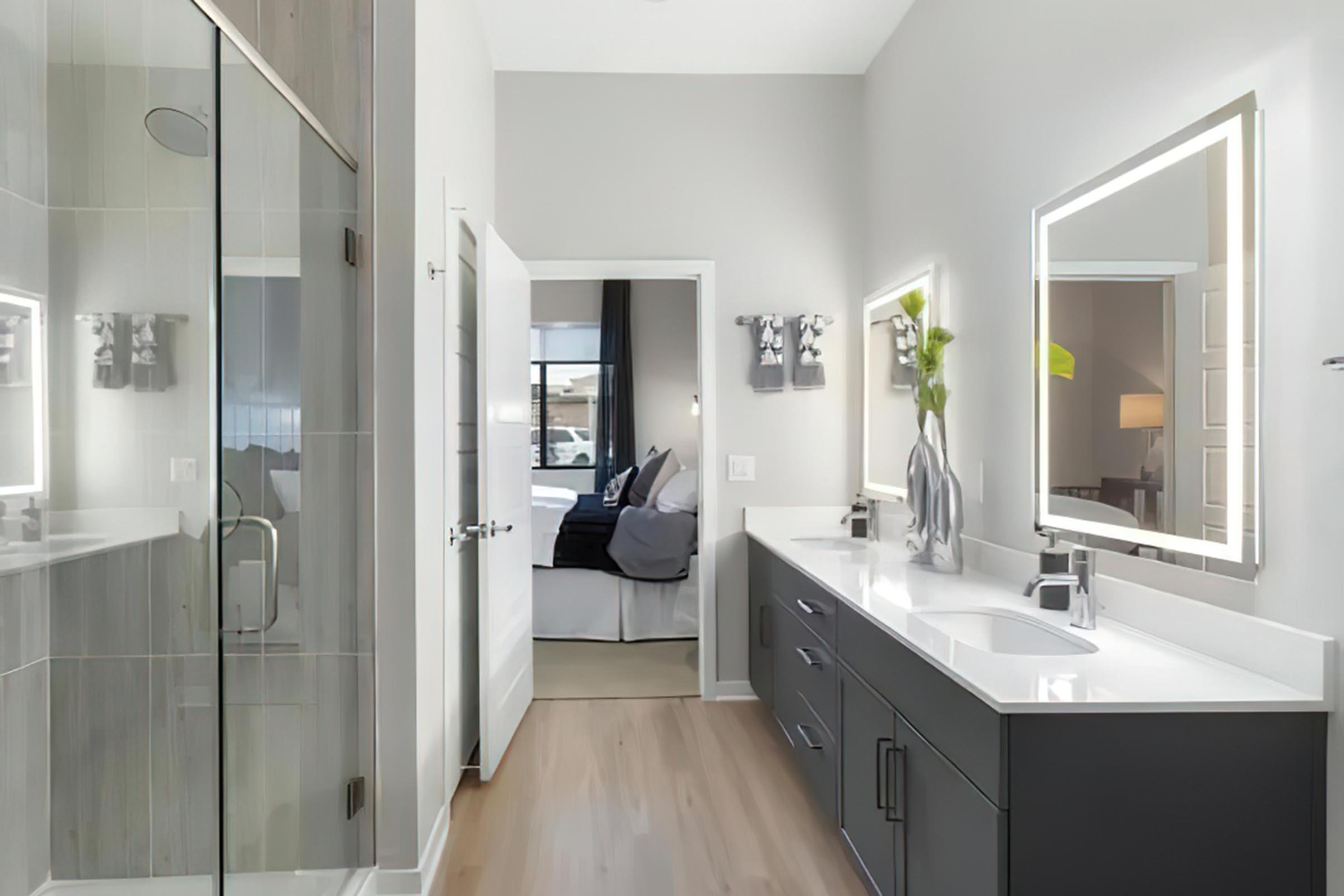 a kitchen with a sink and a mirror