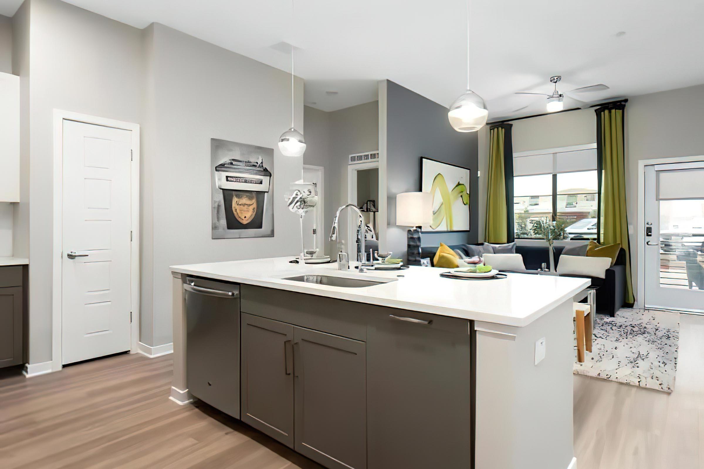 a kitchen with a sink and a mirror