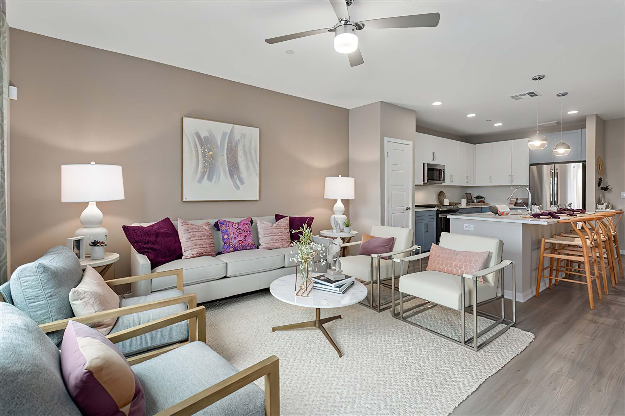 a living room filled with furniture and a table