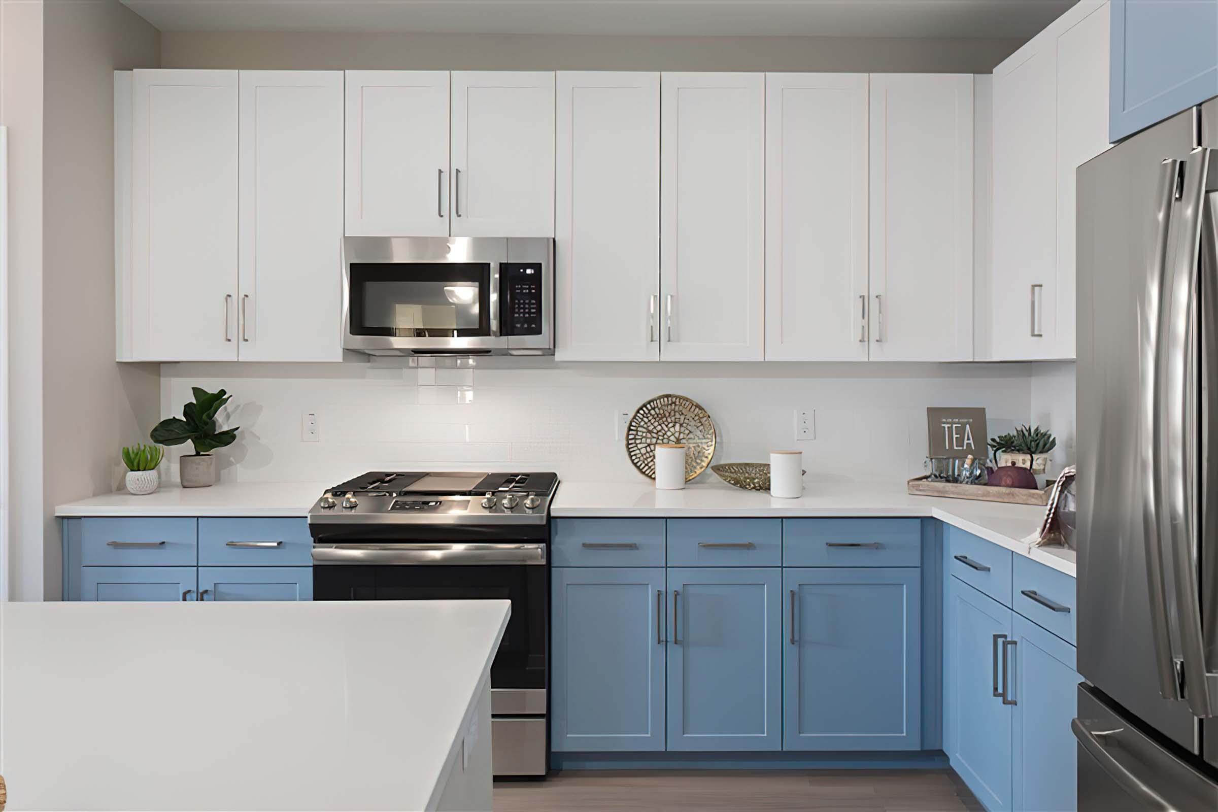 a kitchen with a stove sink and refrigerator