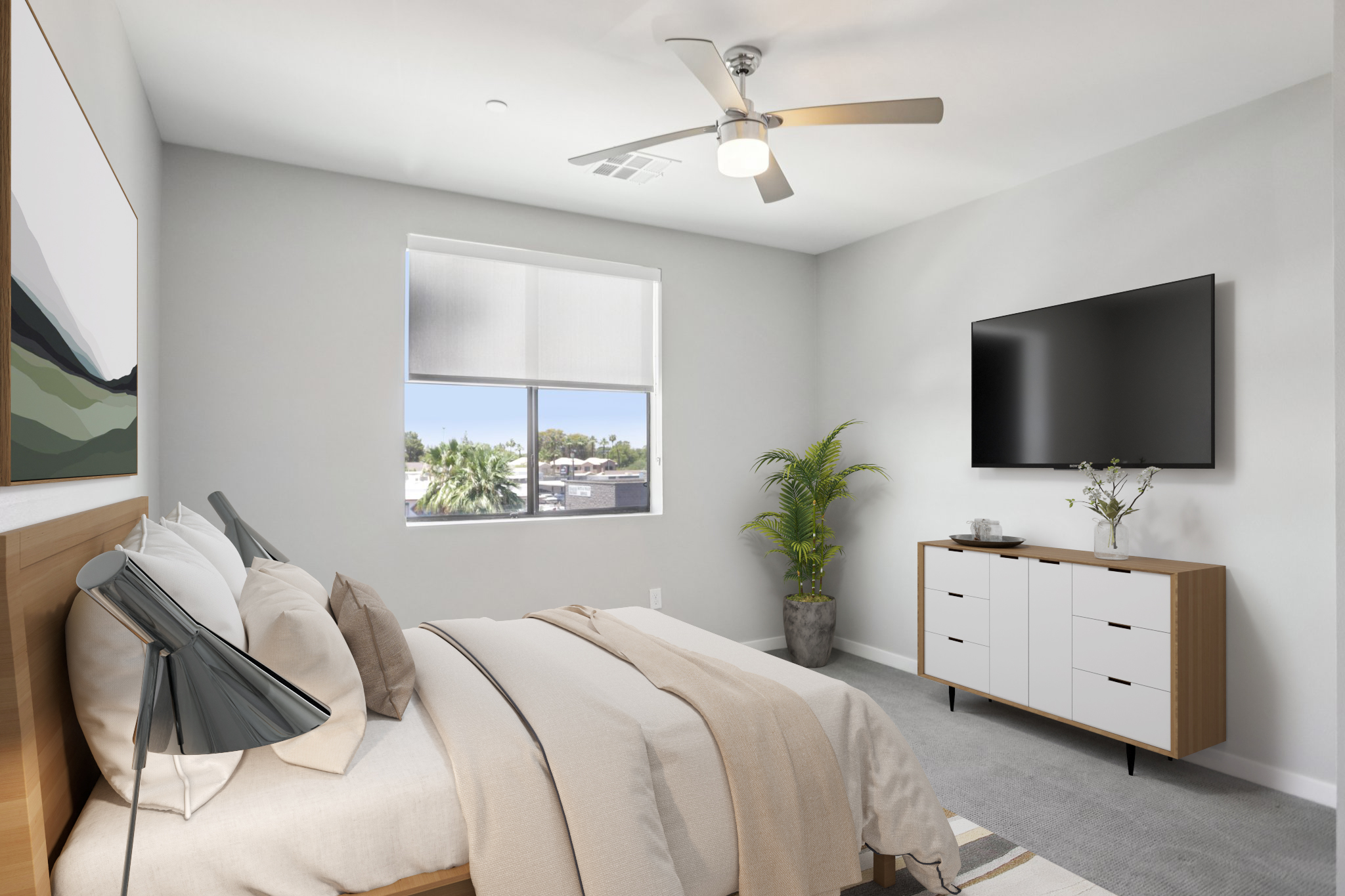 A modern bedroom featuring a bed with light bedding, a ceiling fan, and a wall-mounted TV. Natural light enters through a window with blinds, illuminating a stylish dresser and a potted plant. The room has a minimalist design with neutral colors and contemporary decor elements.