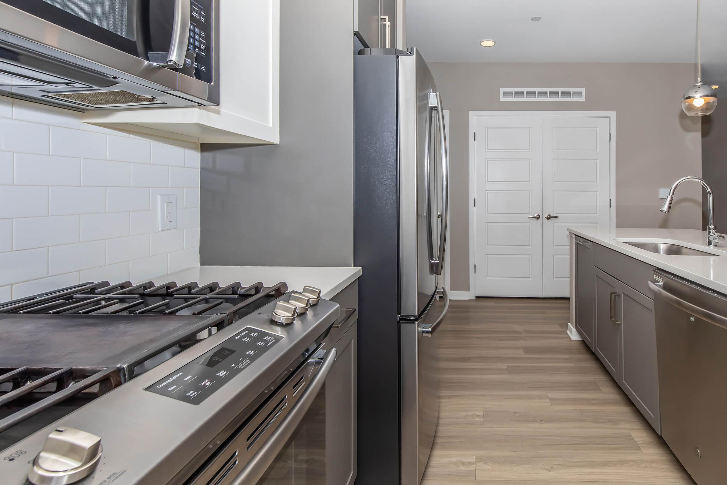 a kitchen with a stove and a sink