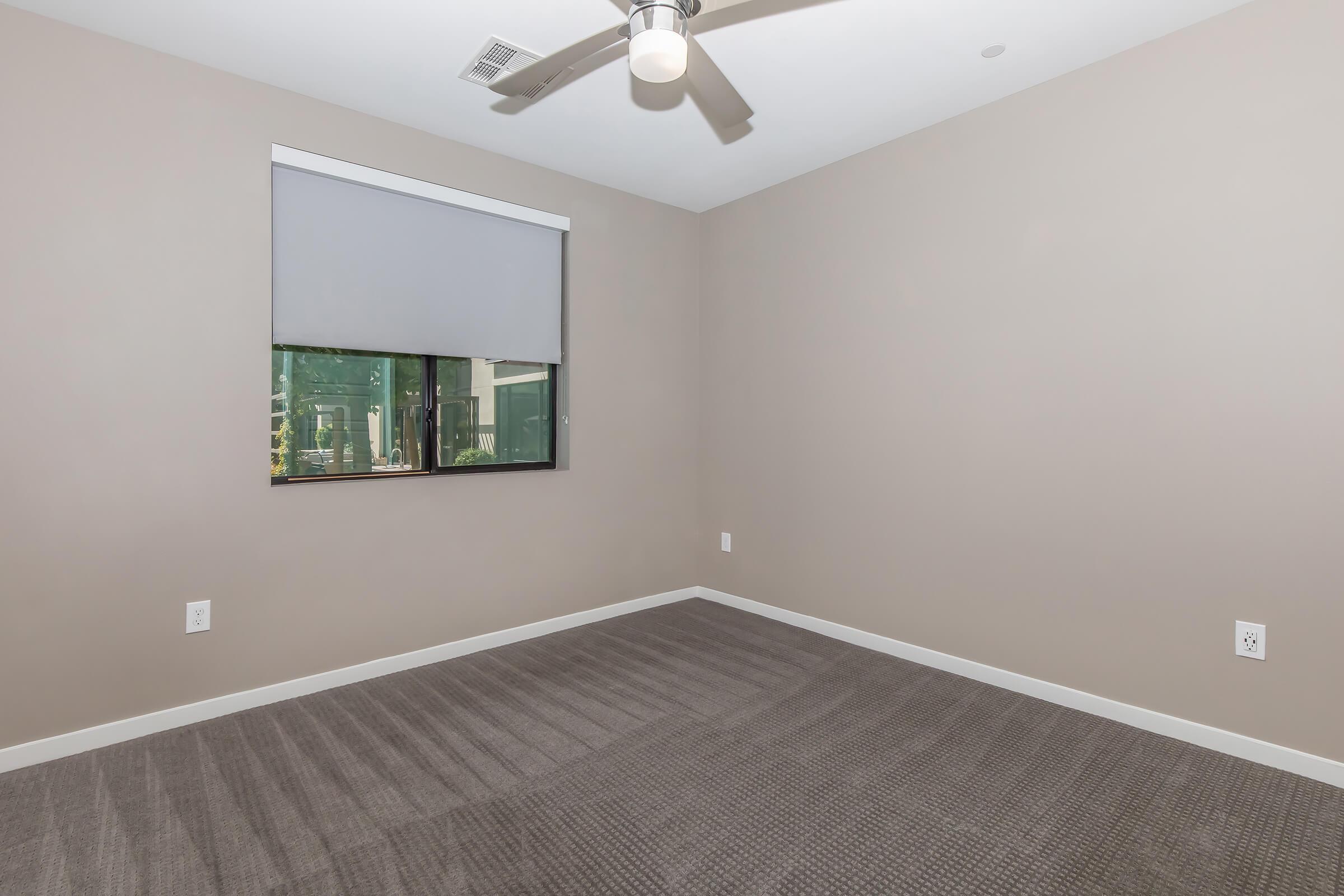 a bedroom with a large mirror