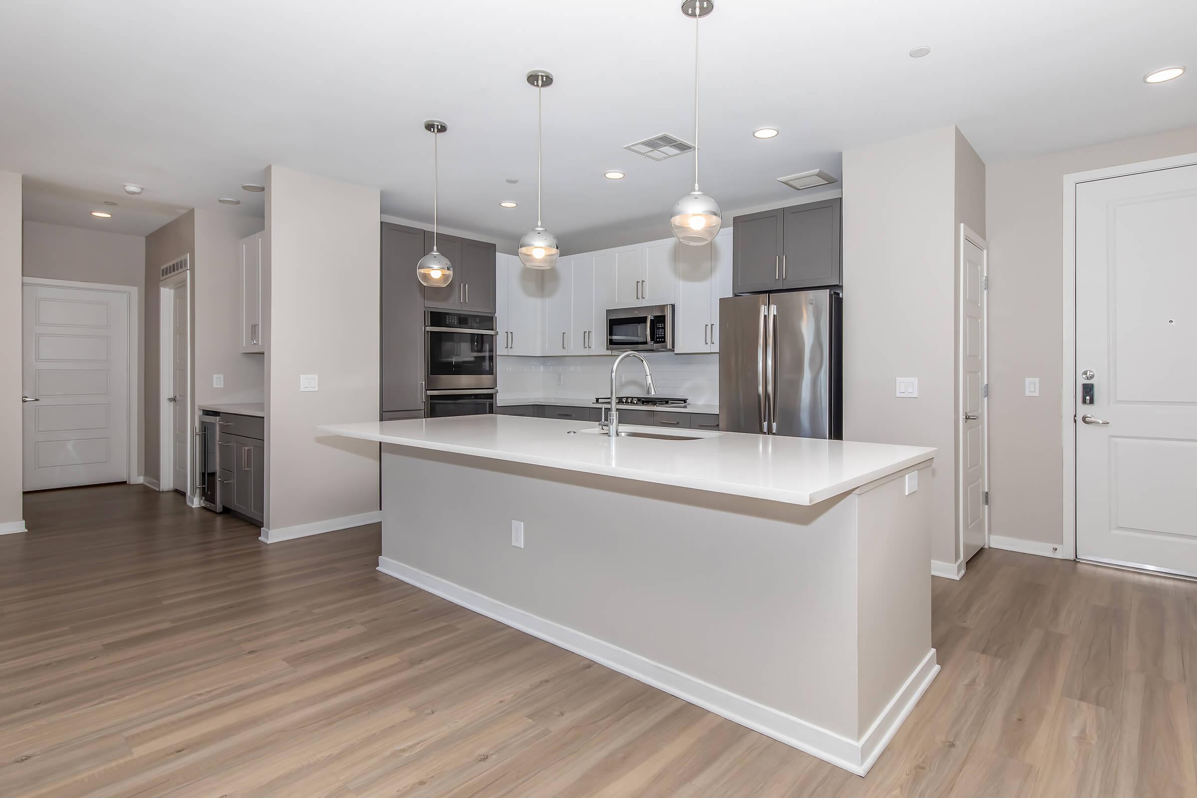 a kitchen with a wood floor