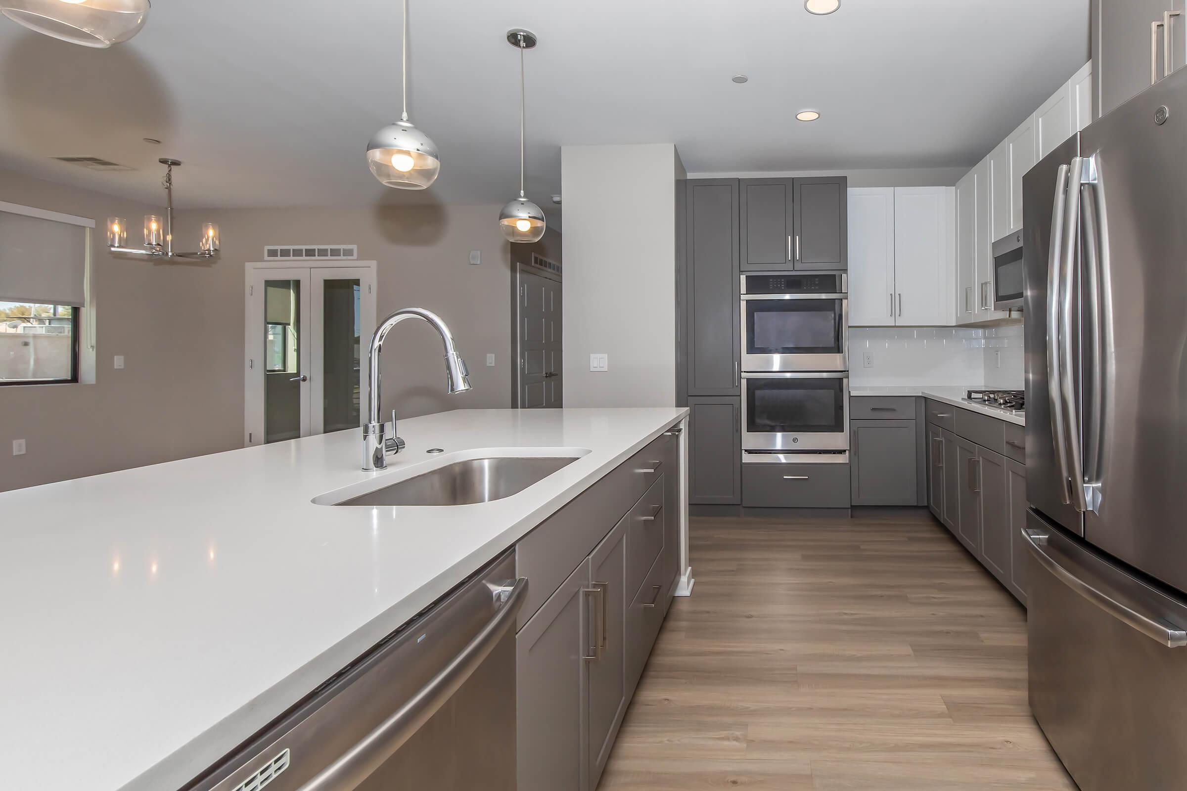 a large kitchen with stainless steel appliances