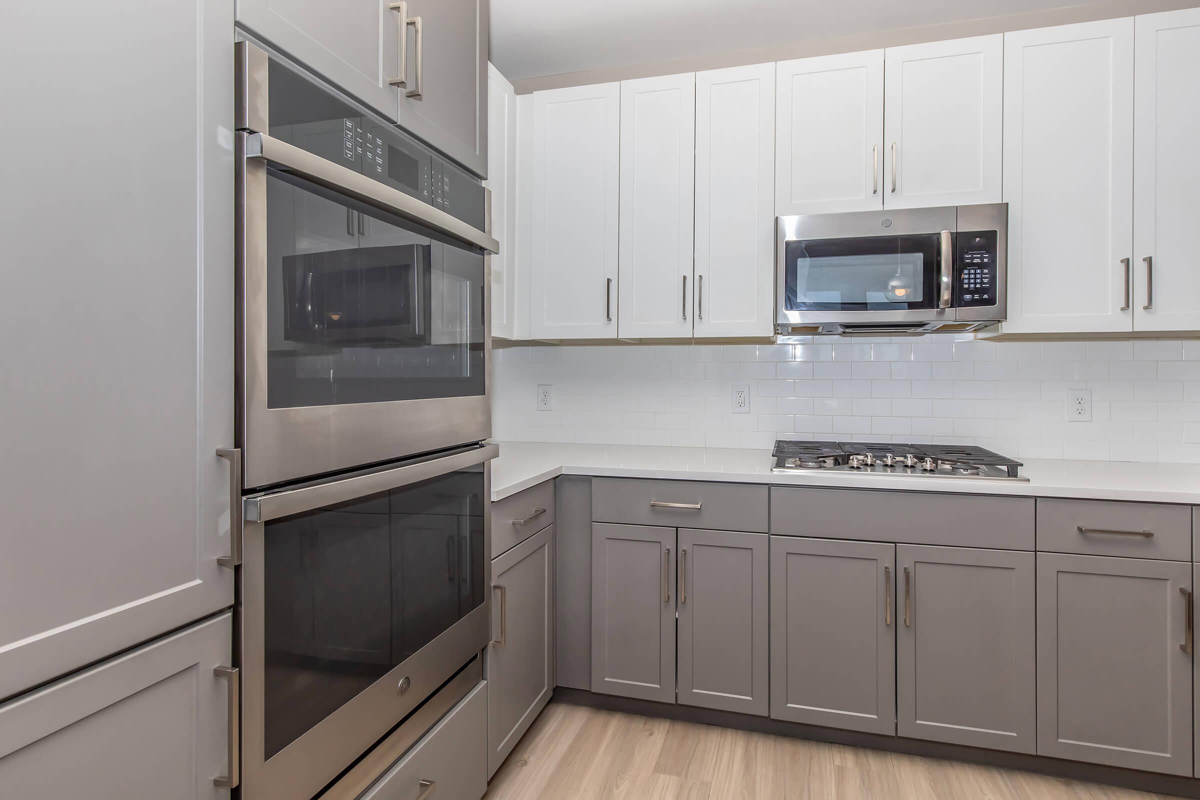 a kitchen with a stove and a refrigerator